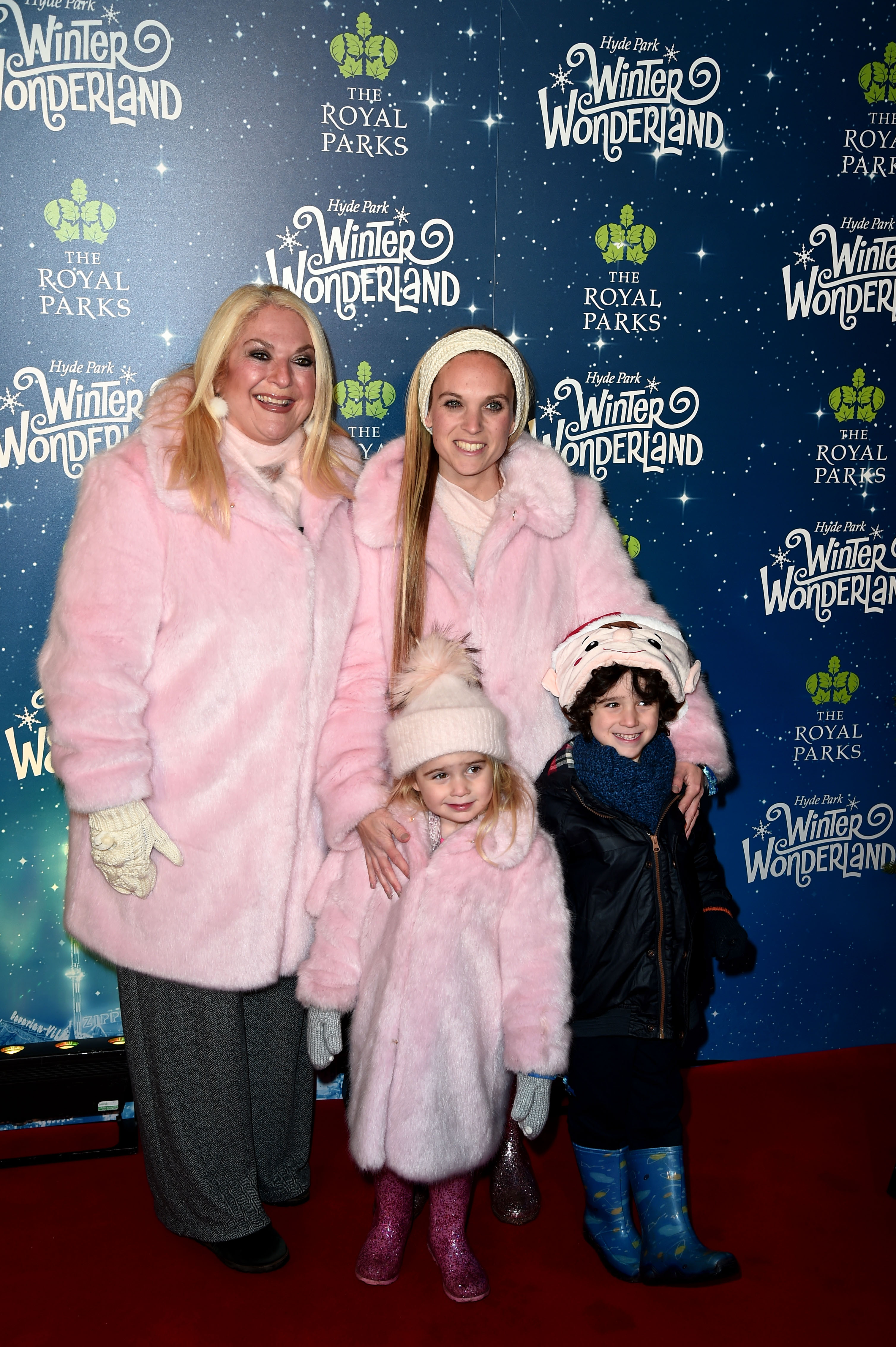 Vanessa Feltz (L) with daughter Allegra Kurer (R) holding her son Ezekiel (R) and daughter Neroli (L) attends the VIP Launch of Hyde Park Winter Wonderland on November 21, 2018 in London, England.