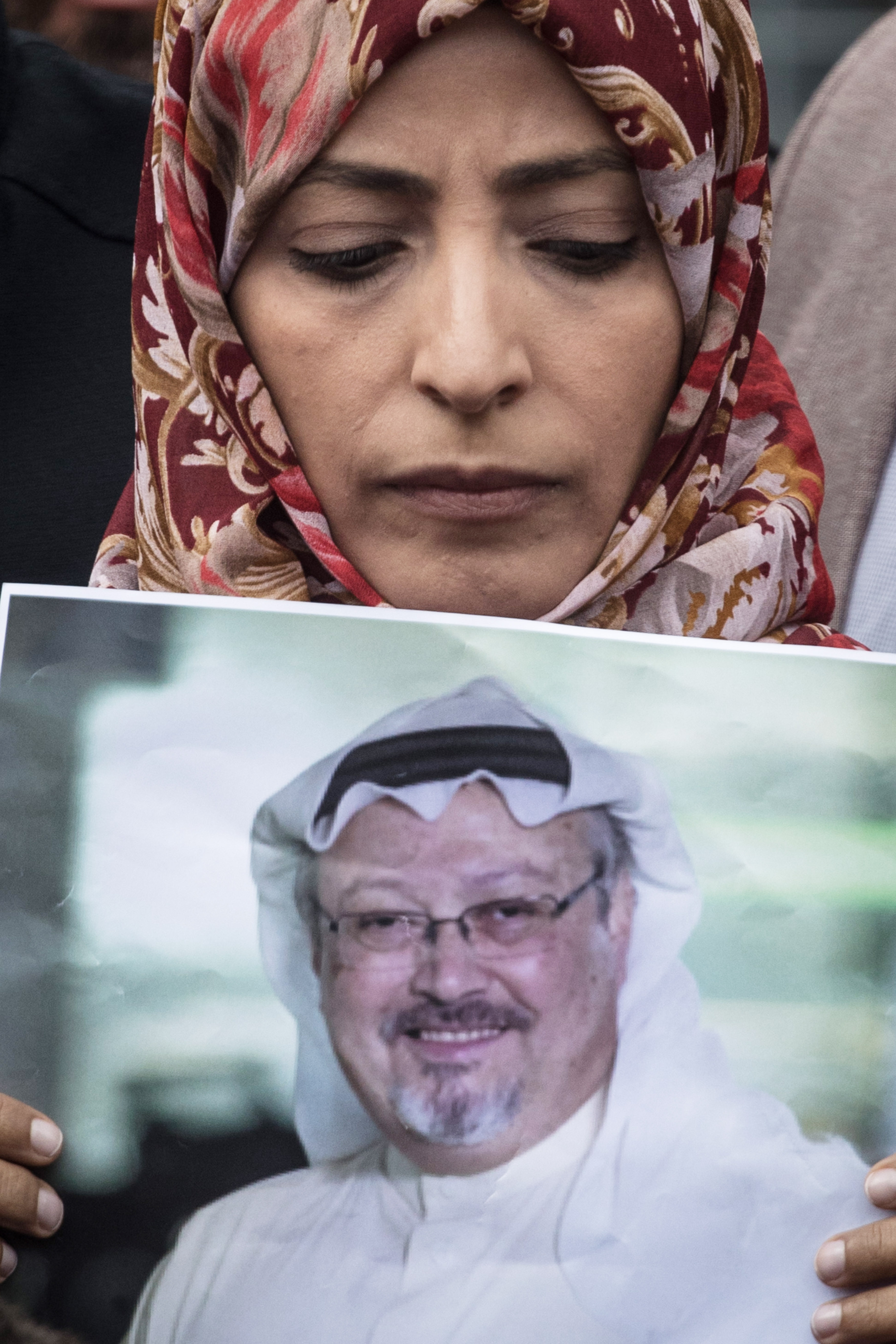 Nobel Prize winner Tawakkol Karman holds a poster of Saudi journalist Jamal Khashoggi during a protest outside Saudi Arabia's consulate on October 8, 2018 in Istanbul, Turkey.
