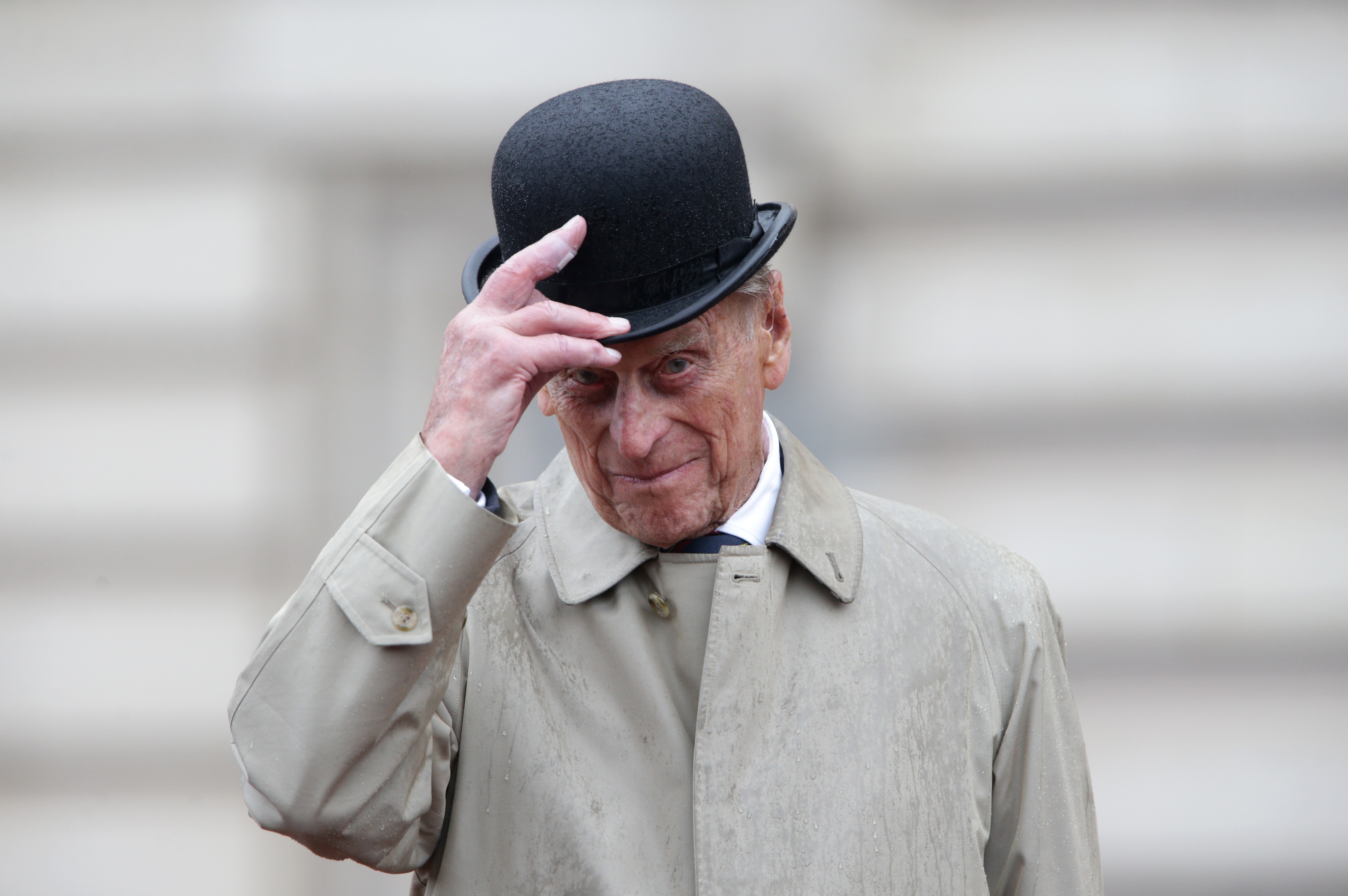 Prince Philip, Duke of Edinburgh raises his hat in his role as Captain General, Royal Marines, makes his final individual public engagement as he attends a parade to mark the finale of the 1664 Global Challenge, on the Buckingham Palace Forecourt on August 2, 2017 in London, England.