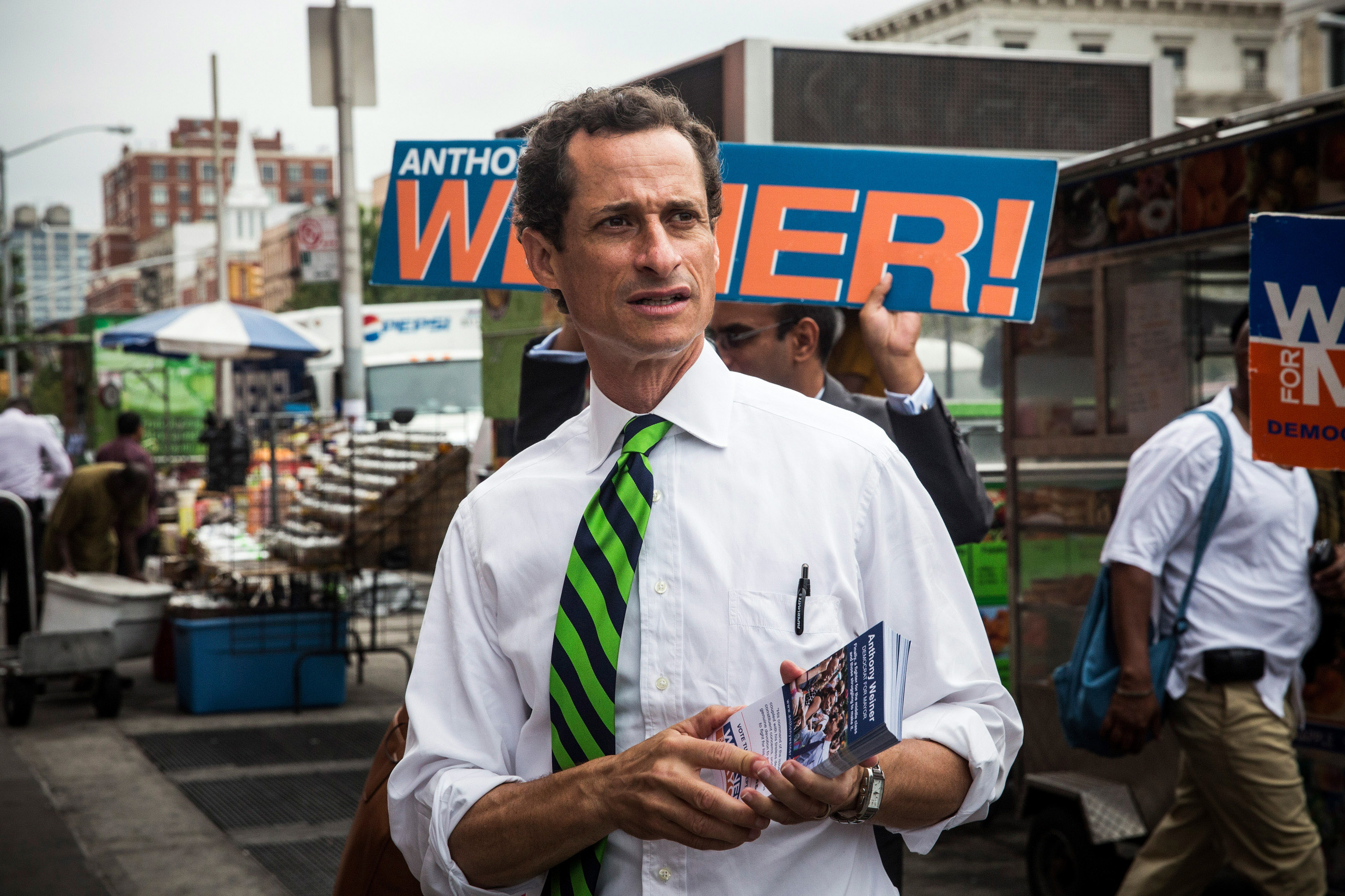 New York City mayoral hopeful Anthony Weiner meets with people on a street corner In Harlem on September 10, 2013 in New York City. Registered voters in New York are voting today in the Democratic and Republican primary races to nominate party candidates for the New York mayoral race. (Getty Images)