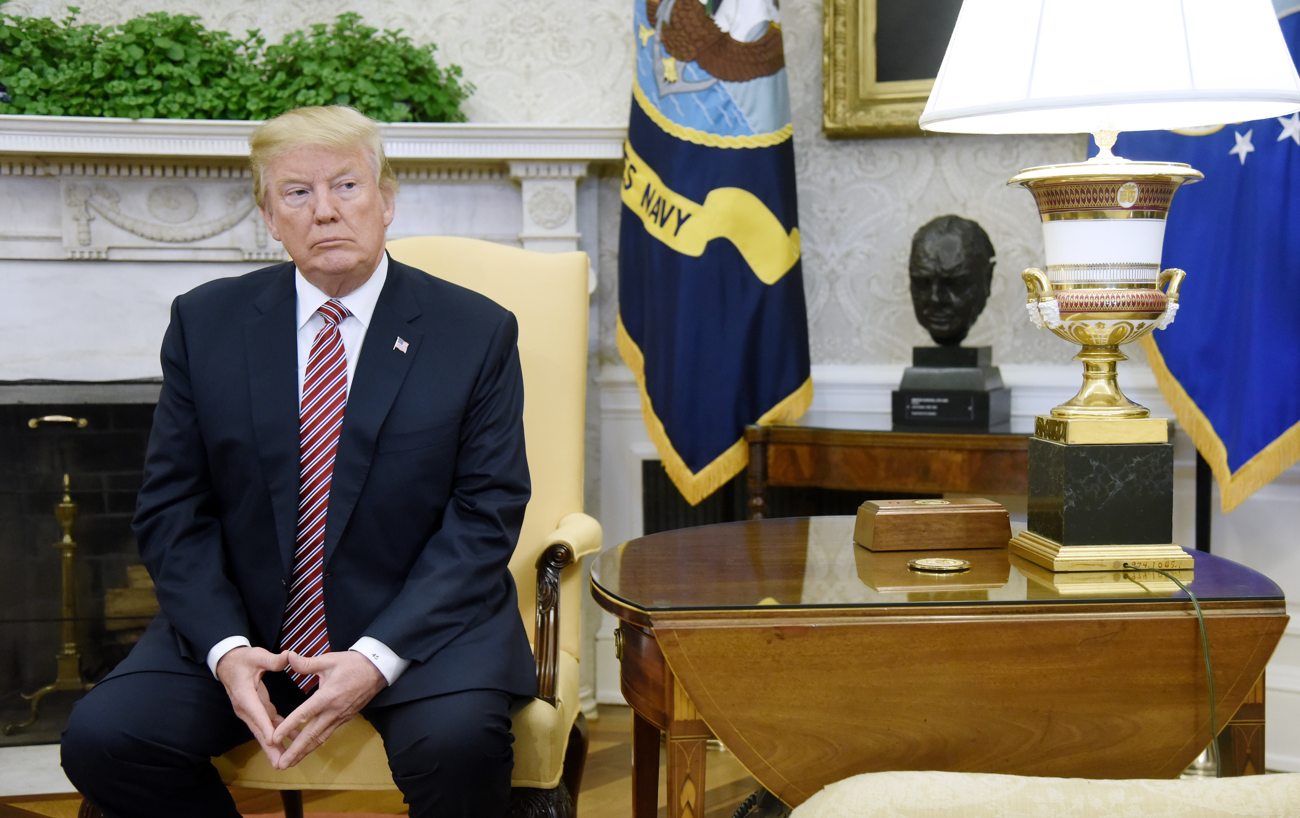 (AFP-OUT) US President Donald Trump looks on during a meeting with Don Bouvet, who has been battling cancer in the Oval Office of the White House, February 9, 2018 in Washington, DC. (Getty Images)