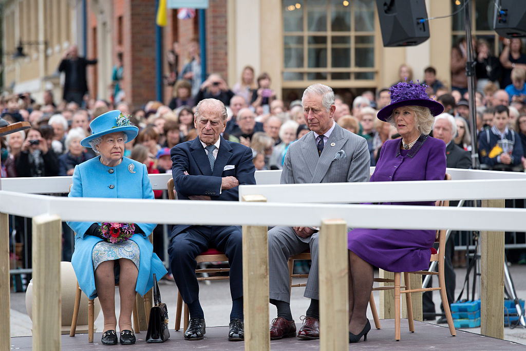 Britain's Queen Elizabeth II, Prince Philip, Duke of Edinburgh, Britain's Prince Charles, Prince of Wales, and Camilla, Duchess of Cornwall listen to speeches before a statue of the Queen Elizabeth, The Queen Mother was unveiled on October 27, 2016 in Poundbury, England (Photo by Justin Tallis - WPA Pool/Getty Images)