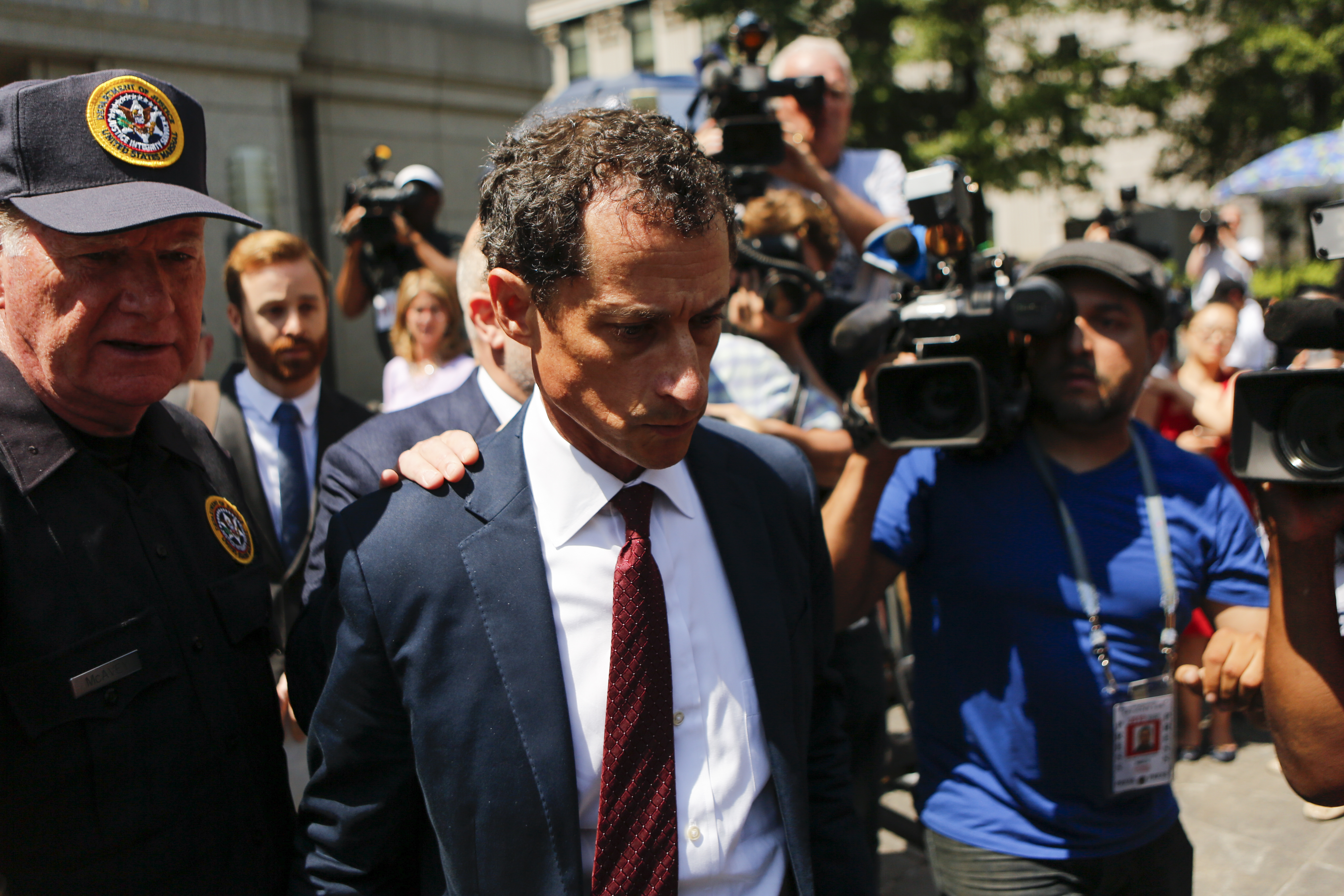 Former Democratic Congressman Anthony Weiner (C) exits federal court in Manhattan after pleading guilty in sexting case on May 19, 2017 in New York City. Weiner, who resigned from Congress over a sexting scanal, pleaded guilty on friday to federal charges of transmitting sexual material to a minor and could face a prison term. (Getty Images)