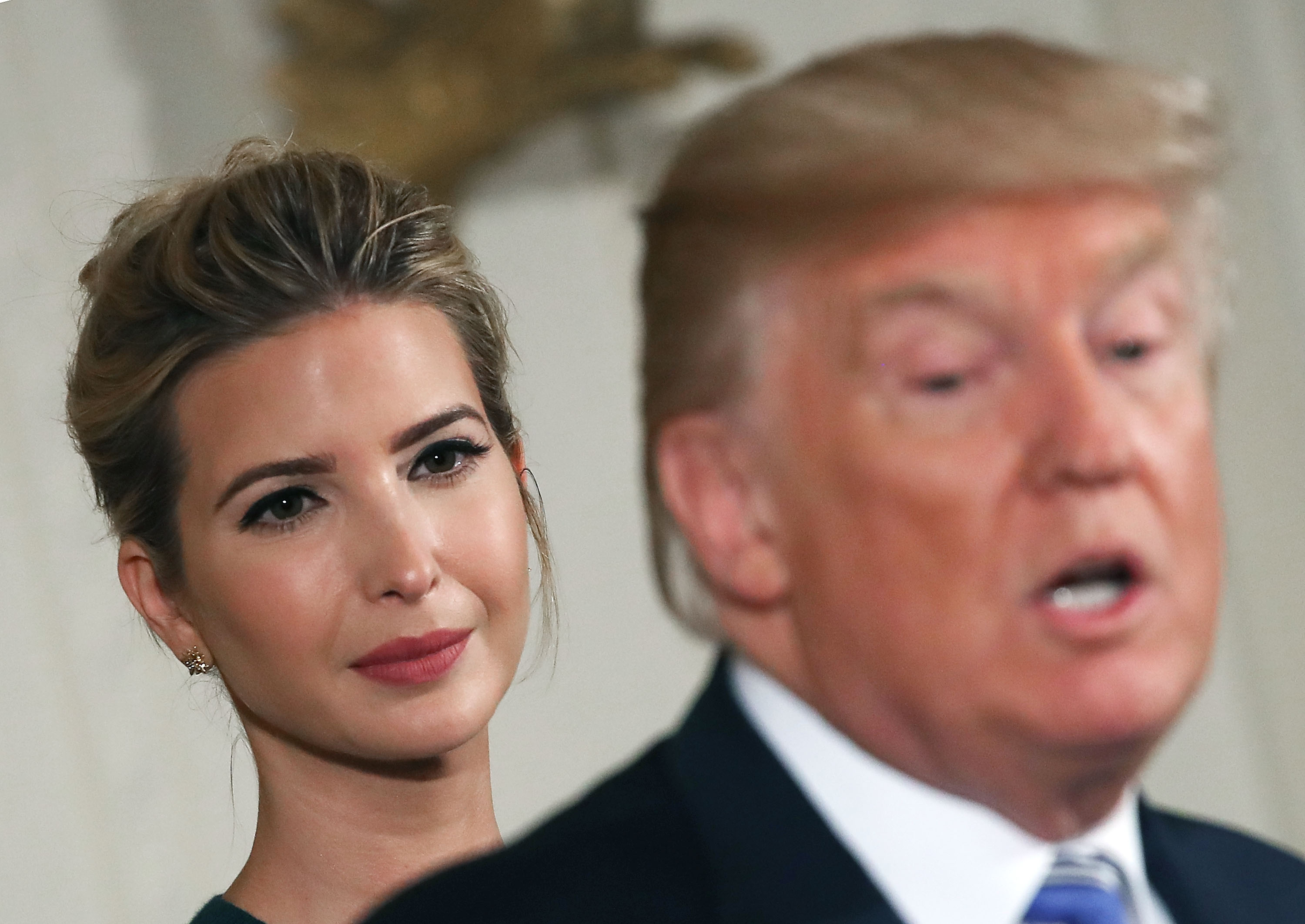 U.S President Donald Trump speaks about small businesses while daughter and advisor to the President Ivanka Trump listens, during event in the East Room at the White House on August 1, 2017 in Washington, DC.