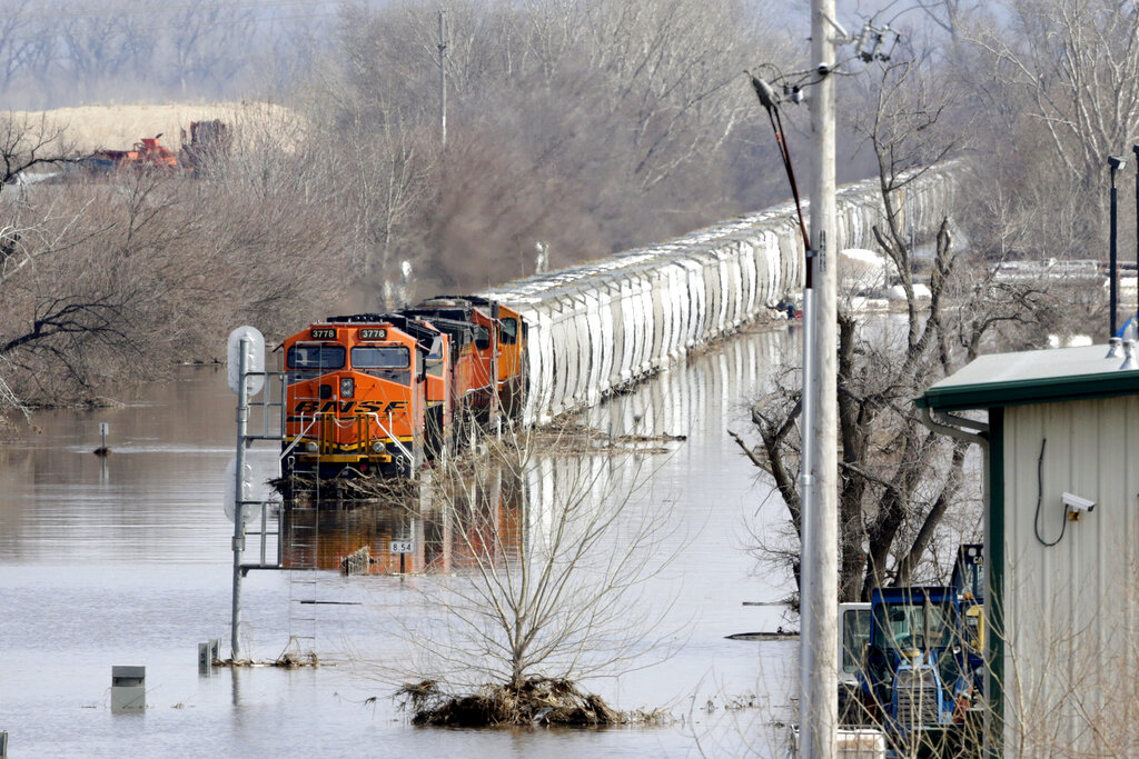 A BNSF train sits in flood waters from the Platte River, in Plattsmouth, Neb., Sunday, March 17, 2019 (AP Photo/Nati Harnik)