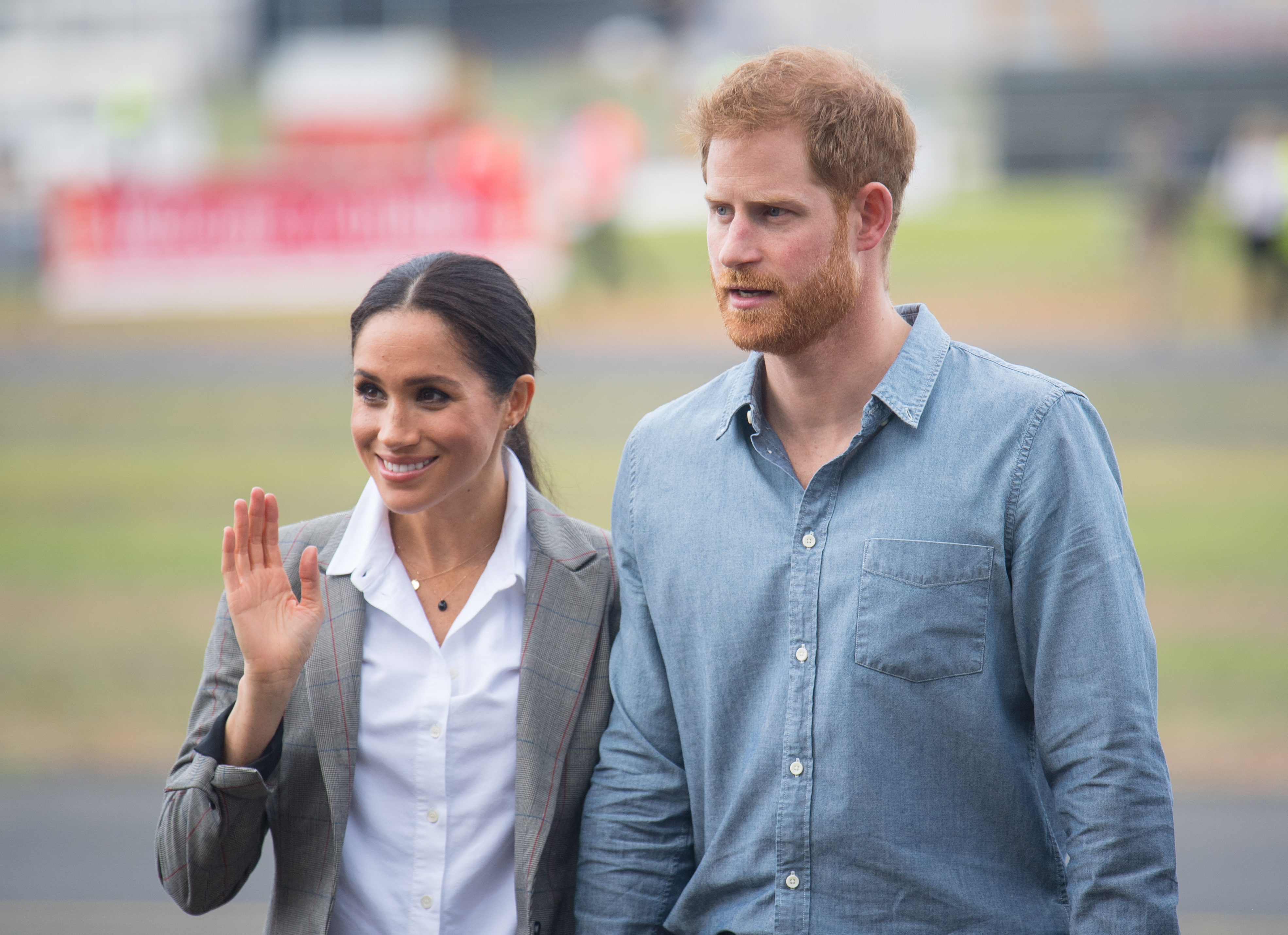 Meghan, Duchess of Sussex and Prince Harry, Duke of Sussex attend a naming and unveiling ceremony for the new Royal Flying Doctor Service aircraft at Dubbo Airport on October 17, 2018 in Dubbo, Australia. The Duke and Duchess of Sussex are on their official 16-day Autumn tour visiting cities in Australia, Fiji, Tonga and New Zealand.