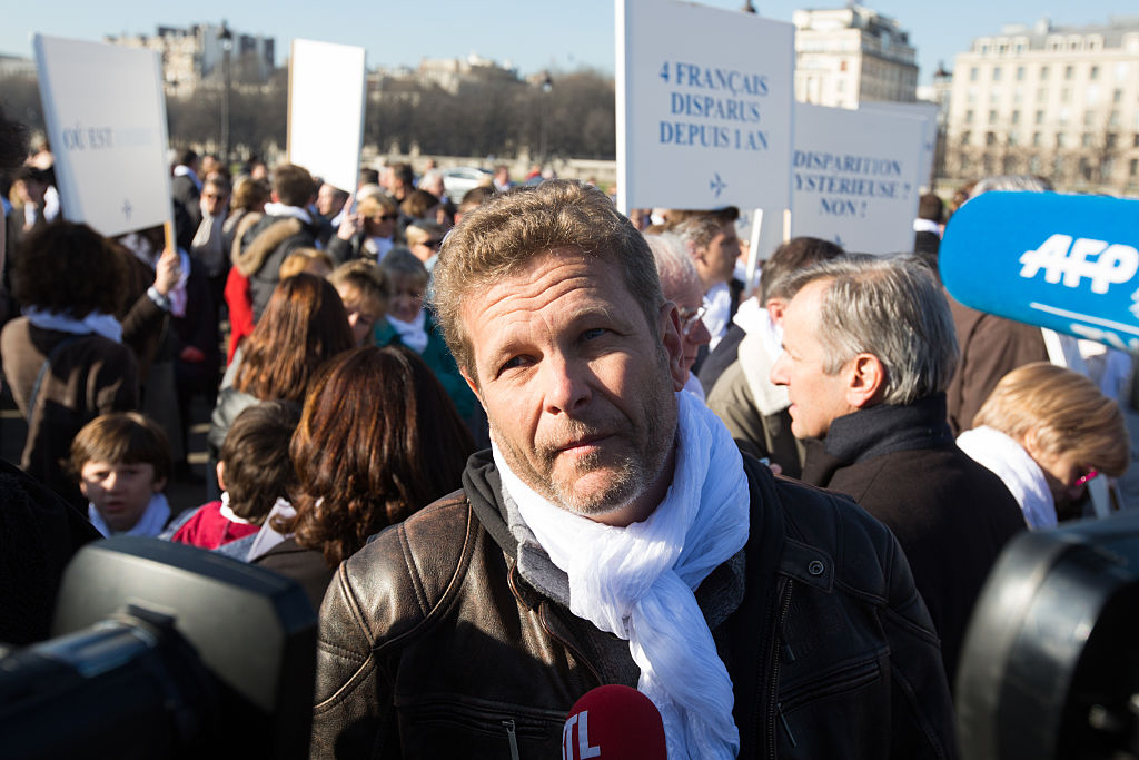 Ghyslain Wattrelos during a silent march towards the Elysee Palace in Paris to deliver a petition signed by 18000 people, on the first anniversary of the disappearance of Malaysia Airlines flight MH370 (Source: Pacific Press/LightRocket via Getty Images)