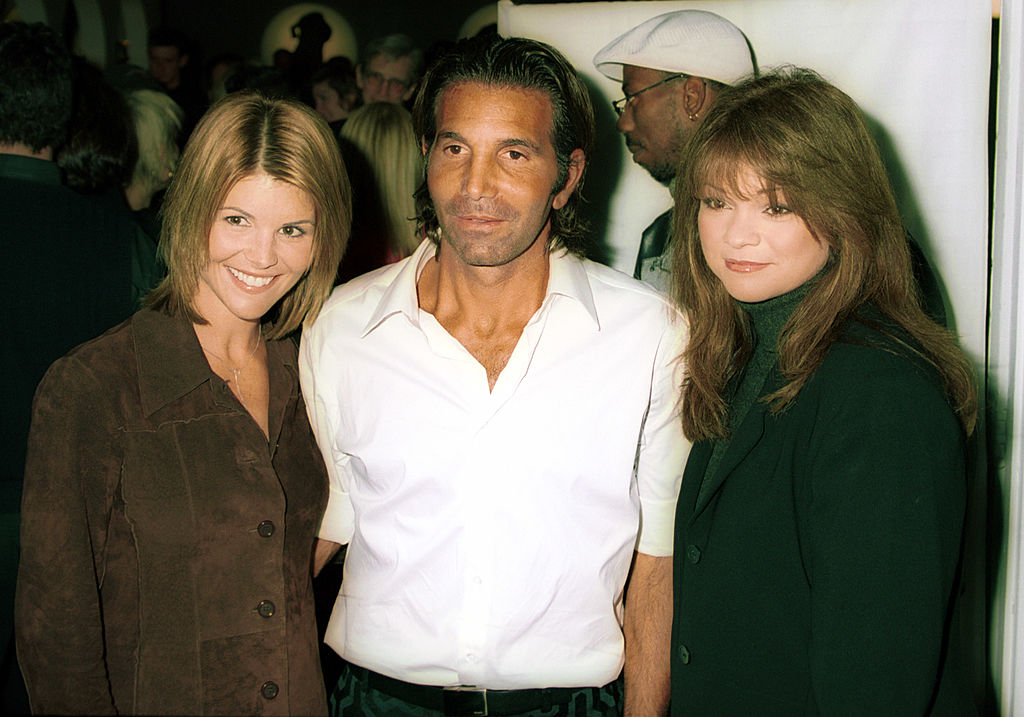 Designer Mossimo Giannulli with actress wife Lori Loughlin left, and actress Valerie Bertinelli attend a party to launch the famed sportswear designer Mossimo Giannulli Collection November 9, 2000 at The Drive-In Studios in New York City. (Photo by George DeSota/Getty Images)