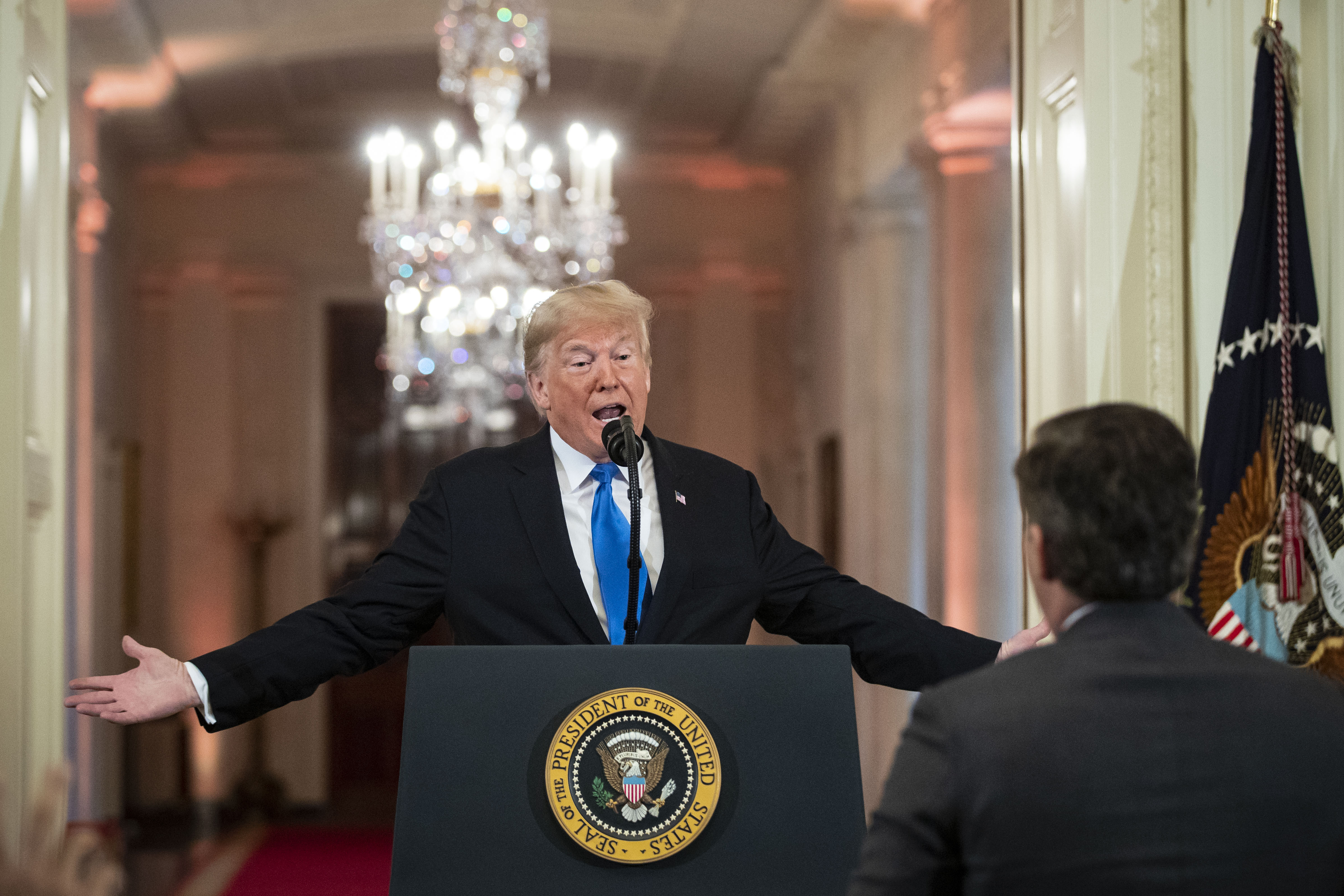 (AFP OUT) U.S. President Donald Trump gets into an exchange with CNN reporter Jim Acosta during a news conference a day after the midterm elections on November 7, 2018 in the East Room of the White House in Washington, DC. Republicans kept the Senate majority but lost control of the House to the Democrats.