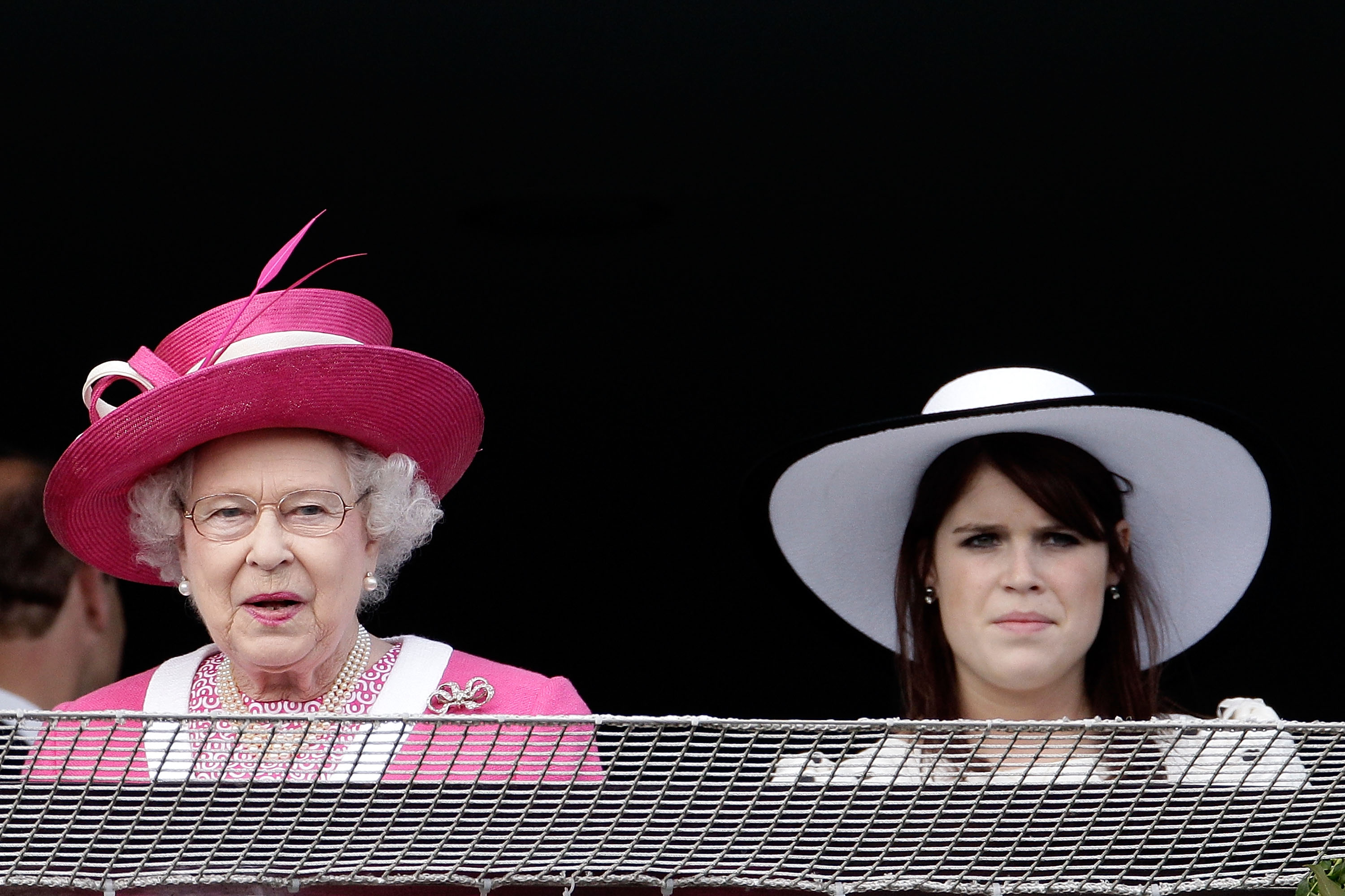 Queen Elizabeth II and Princess Eugenie react as the Queen's horse Carlton House comes in third in the Epsom Derby at Epsom Downs racecourse on June 4, 2011 in Epsom, England. Carlton Hall had been the Bookmakers favourite to win the Derby, but came in third place, with Pour Moi winning.