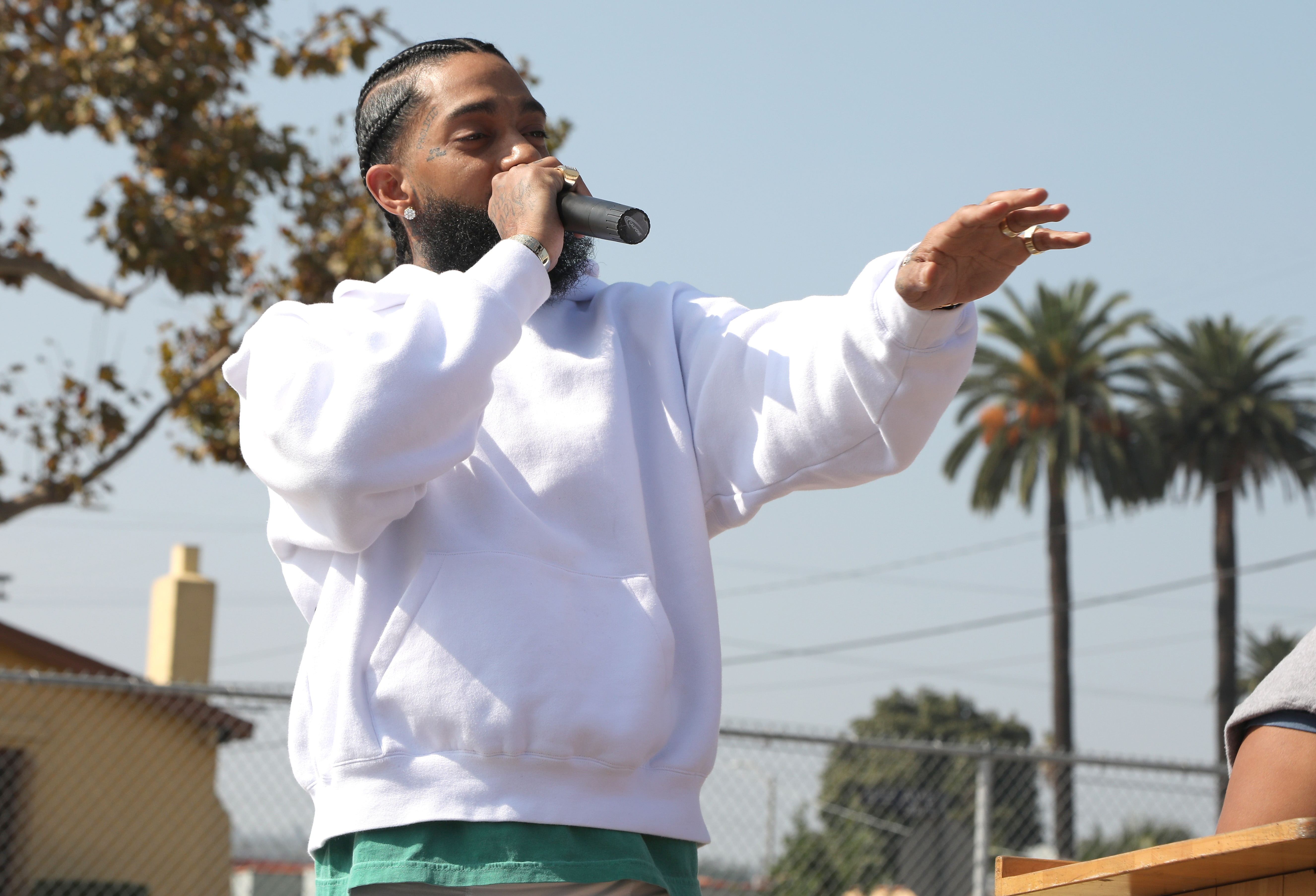 Nipsey Hussle speaks to kids at the Nipsey Hussle x PUMA Hoops Basketball Court Refurbishment Reveal Event on October 22, 2018 in Los Angeles, California.