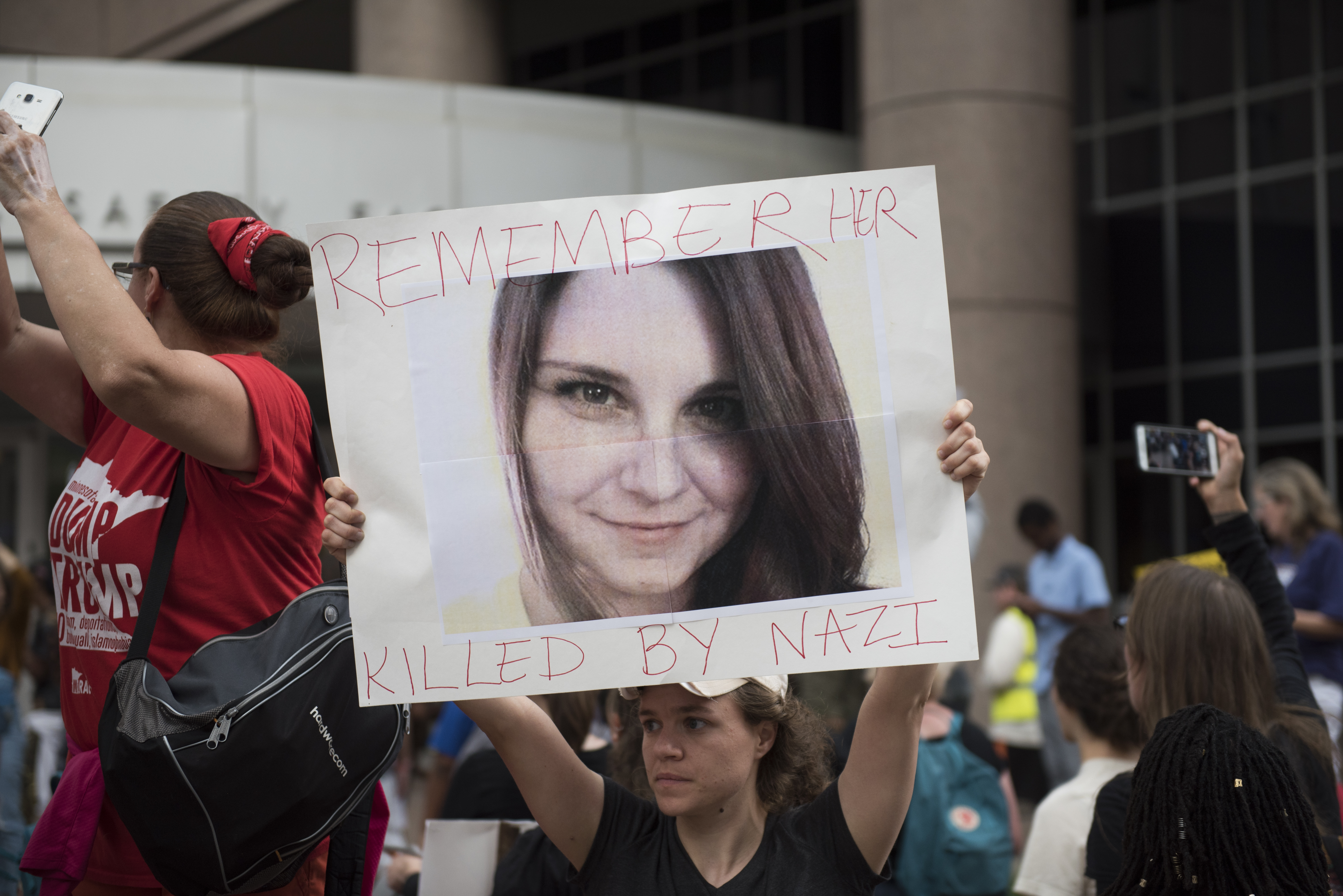 A protesters carries an image of Heather Heyer during a demonstration against racism and the violence over the weekend in Charlottesville, Virginia on August 14, 2017 in Minneapolis, Minnesota. Protesters estimated at more than 1,000 blocked streets and light rail during the action.