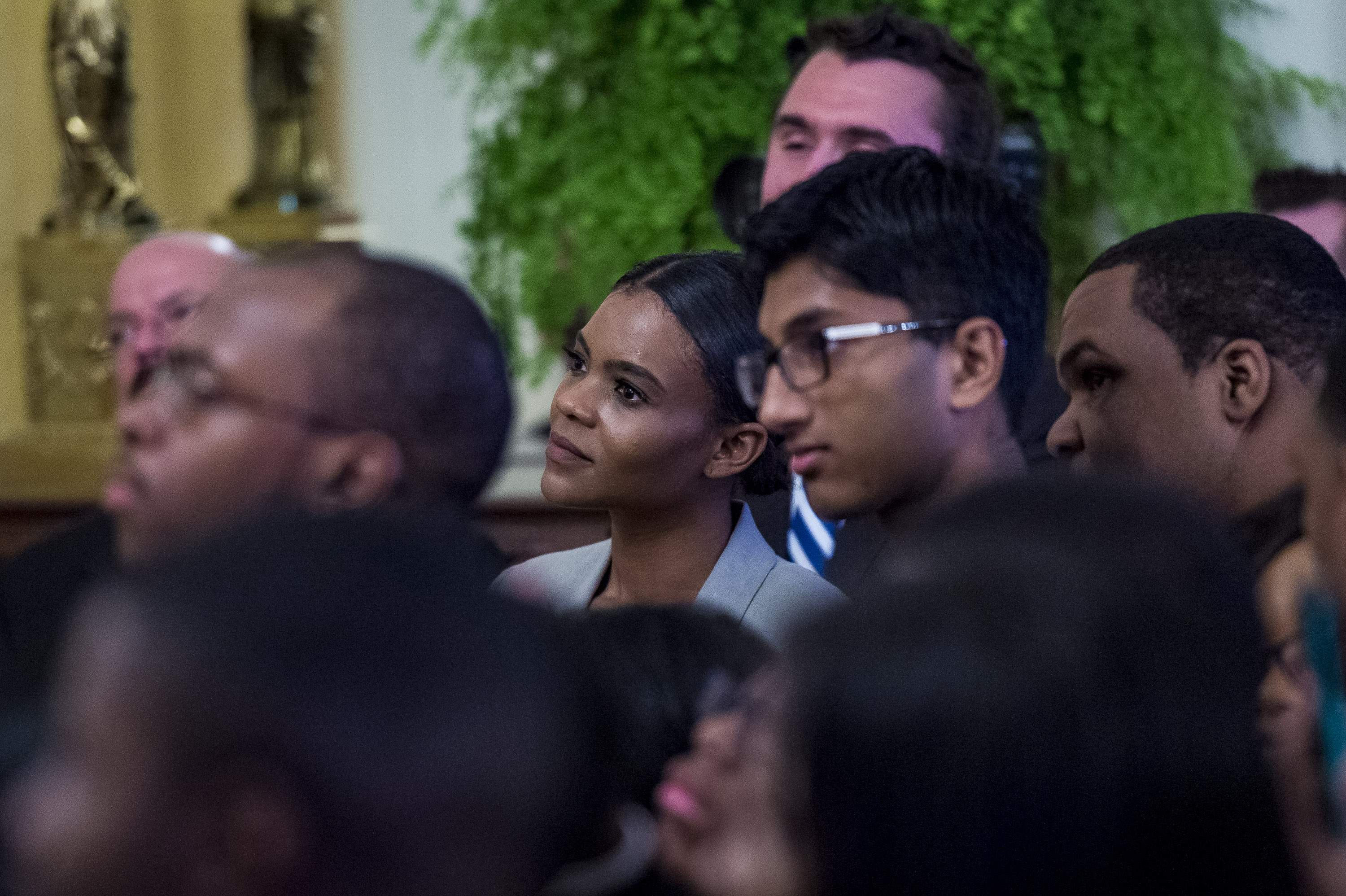 Turning Point USA communications director Candace Owens looks on as U.S. President Donald Trump addresses young black conservative leaders from across the country as part of the 2018 Young Black Leadership Summit at White House on October 26, 2018, in Washington, DC. (Getty)