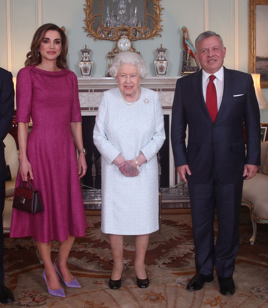 Her Highness took center stage in the official pictures of the meeting, but when people tried to get a clearer view of the Queen's hands, they looked strangely bruised and purple, giving people reason to fear for her well-being. (Photo by Yui Mok - WPA Pool/Getty Images)