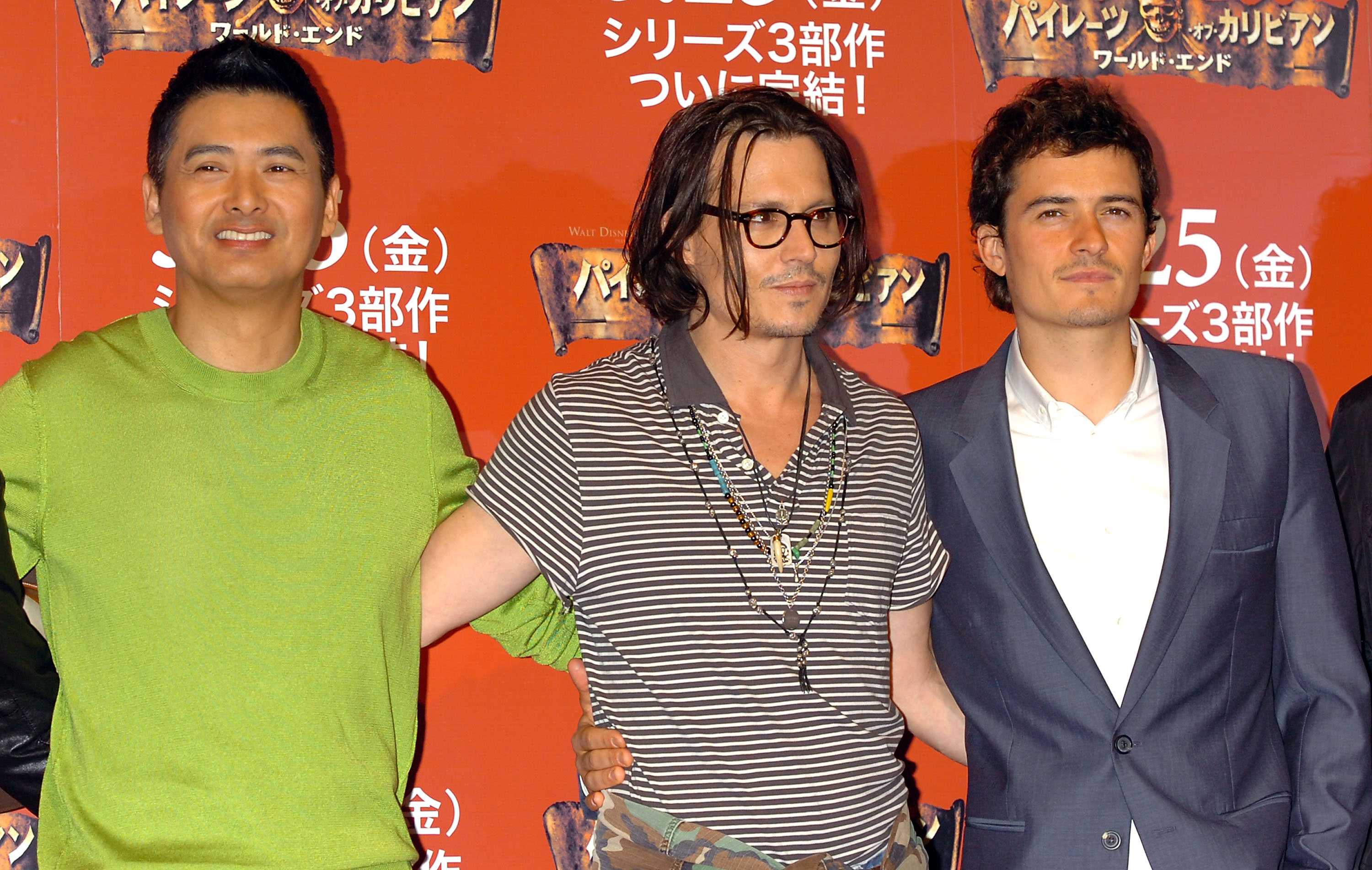 (L-R) Actors Chow Yun-Fat, Johnny Depp and Orlando Bloom attend a photocall to promote Walt Disney's 'Pirates Of The Caribbean: At World's End' May 23, 2007 in Tokyo, Japan. The film will open May 25 worldwide.