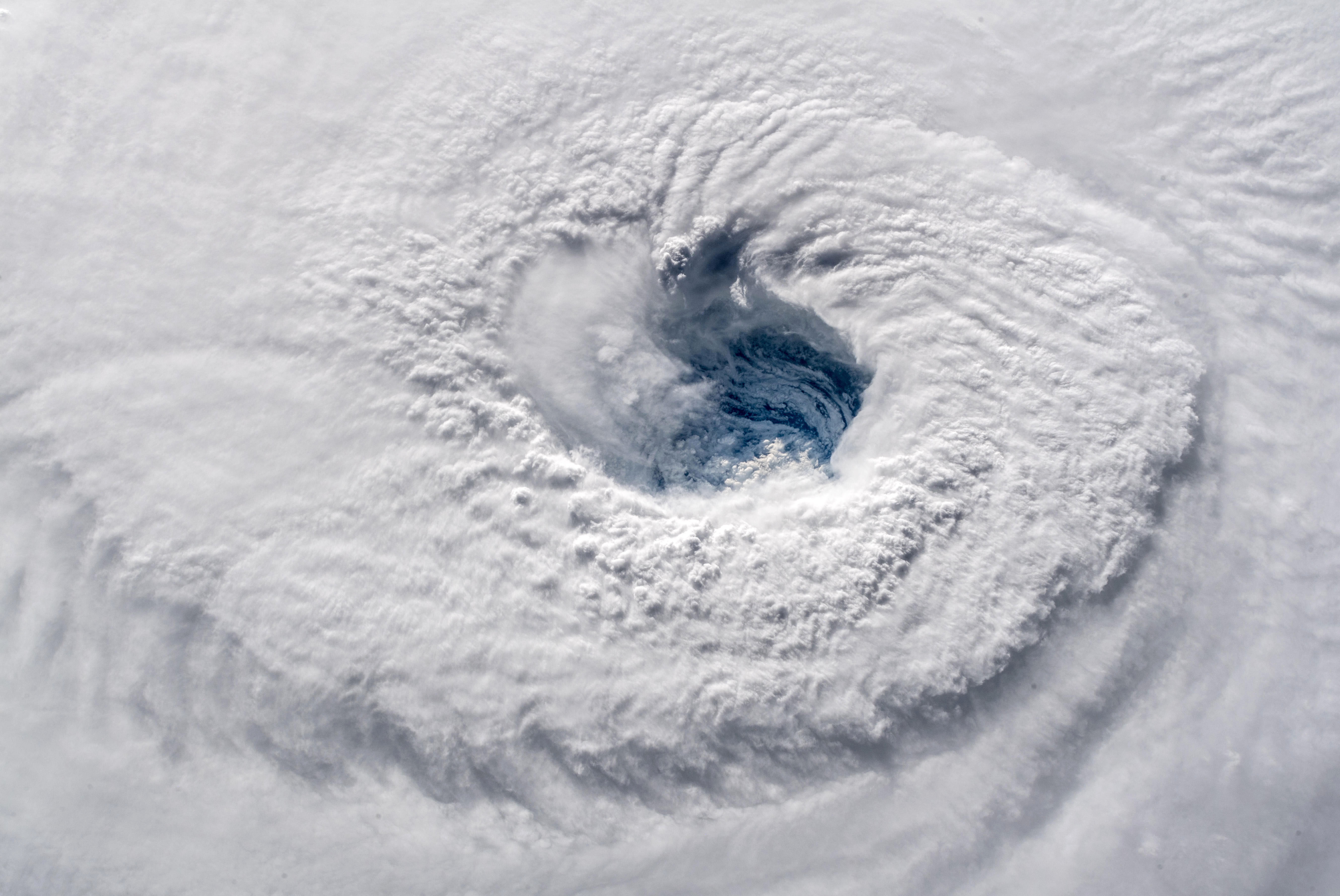 In this satellite image provided by the National Aeronatics and Space Administration (NASA) and European Space Agency (ESA), Hurricane Florence churns through the Atlantic Ocean toward the U.S. East Coast on September 12, 2018.