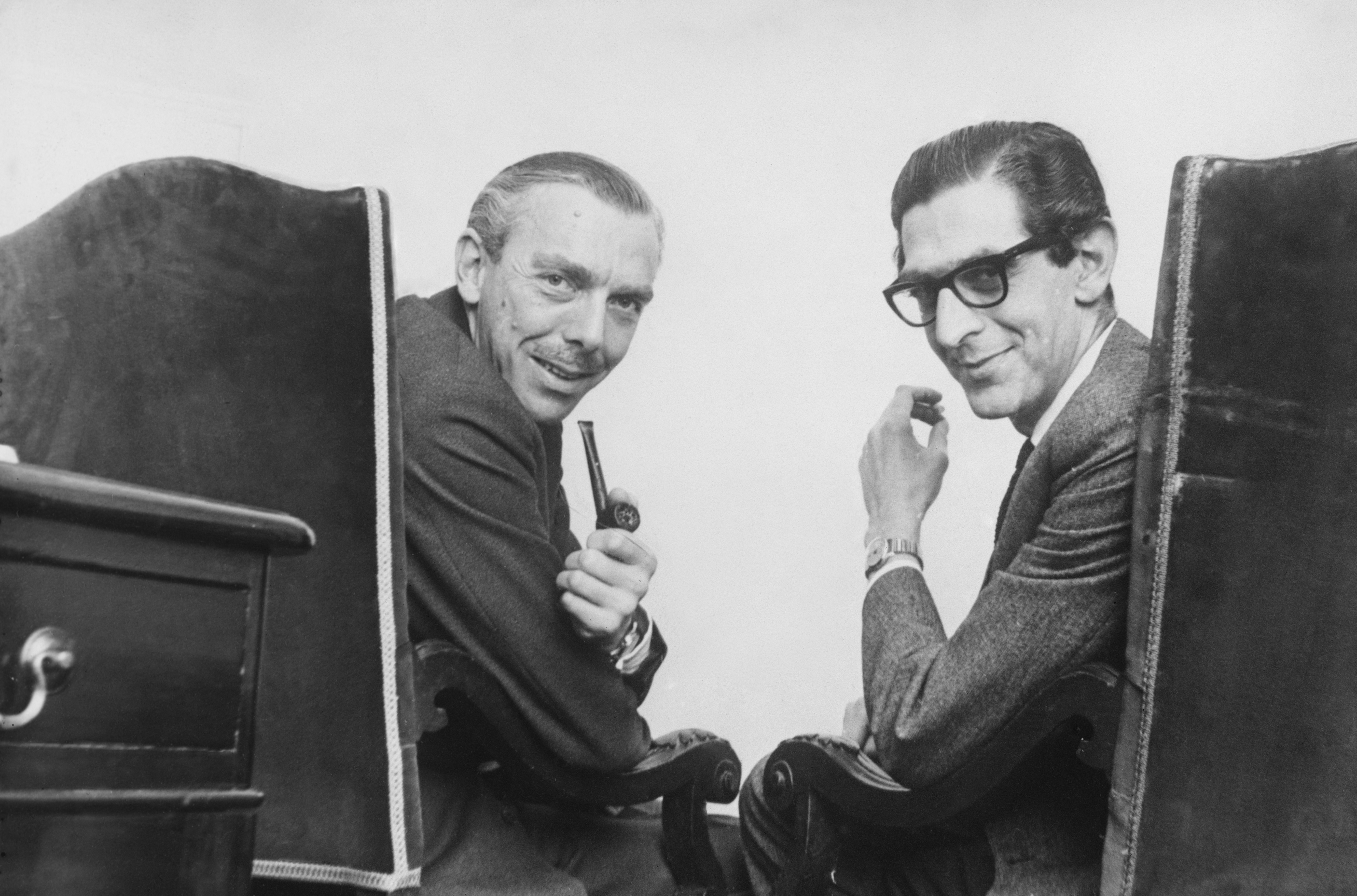 English comedy writers Frank Muir (1920 - 1998, left) and Denis Norden (1922 - 2018) at their office in Regent Street, London, 30th April 1963. (Photo by Hulton Archive/Getty Images)