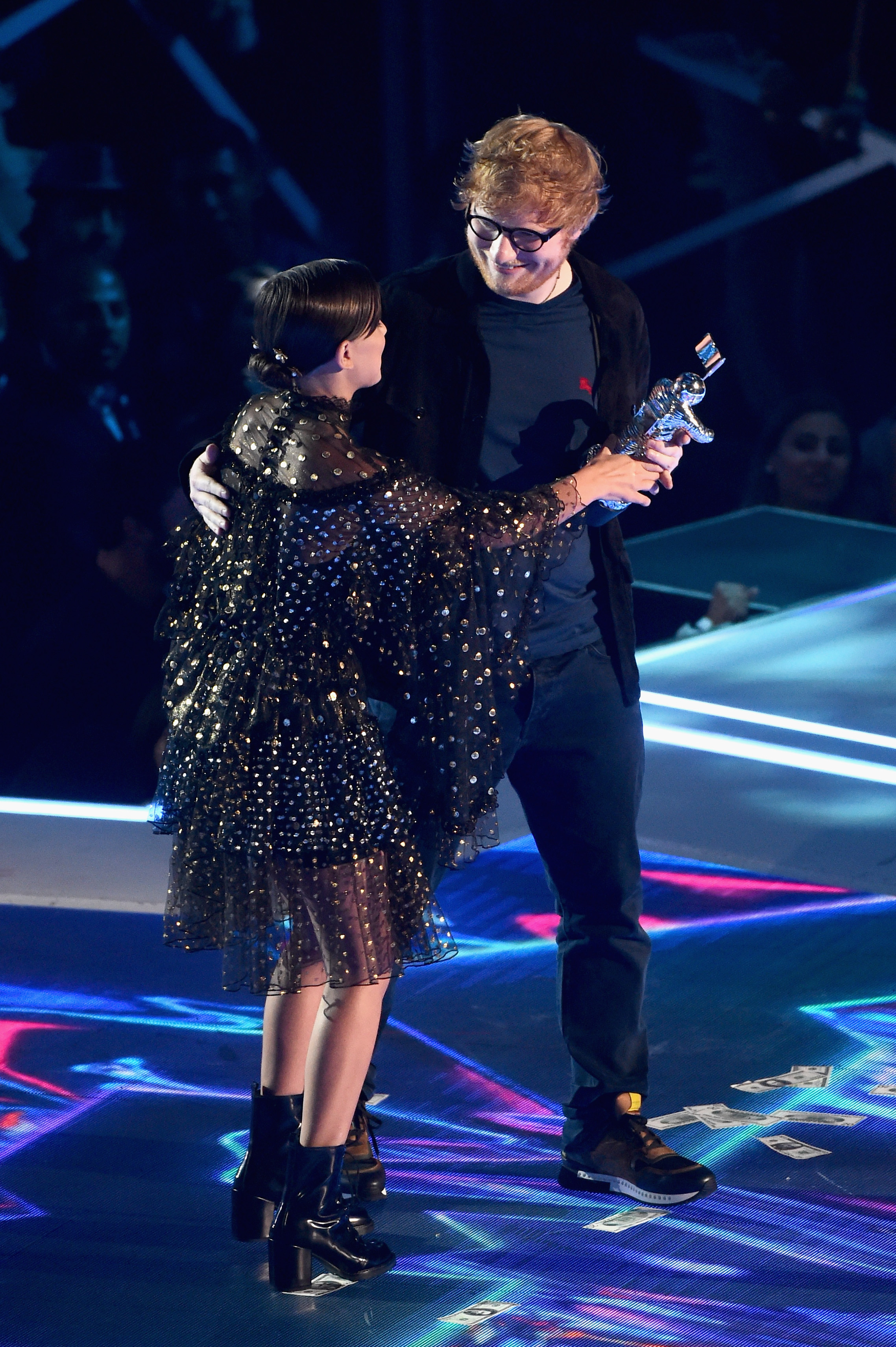 Millie Bobby Brown (L) presents the Artist of the Year award to Ed Sheeran onstage during the 2017 MTV Video Music Awards at The Forum on August 27, 2017, in Inglewood, California (Getty Images)