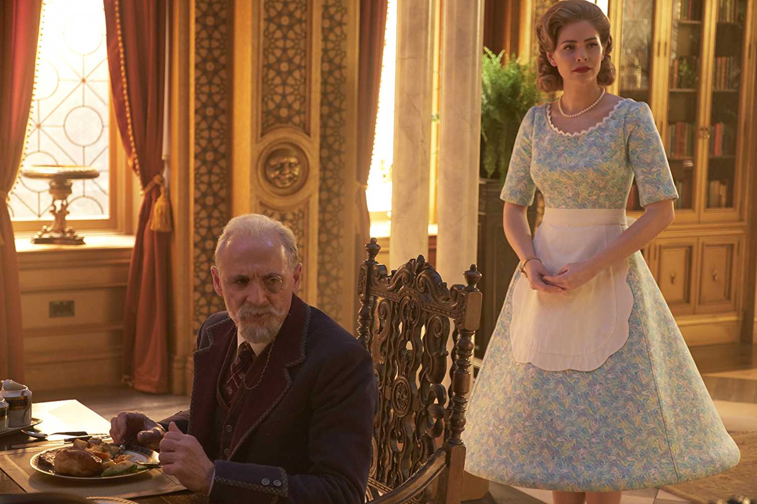 Sir Reginald Hargreeves (Colm Feore) and Grace (Jordan Claire Robbins) in 'The Umbrella Academy'.
(Source: IMDB)