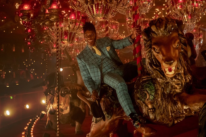 Mr. Nancy on the carousel before entering 'Backstage' in 'American Gods' season 2 episode 1. (Source: Starz)