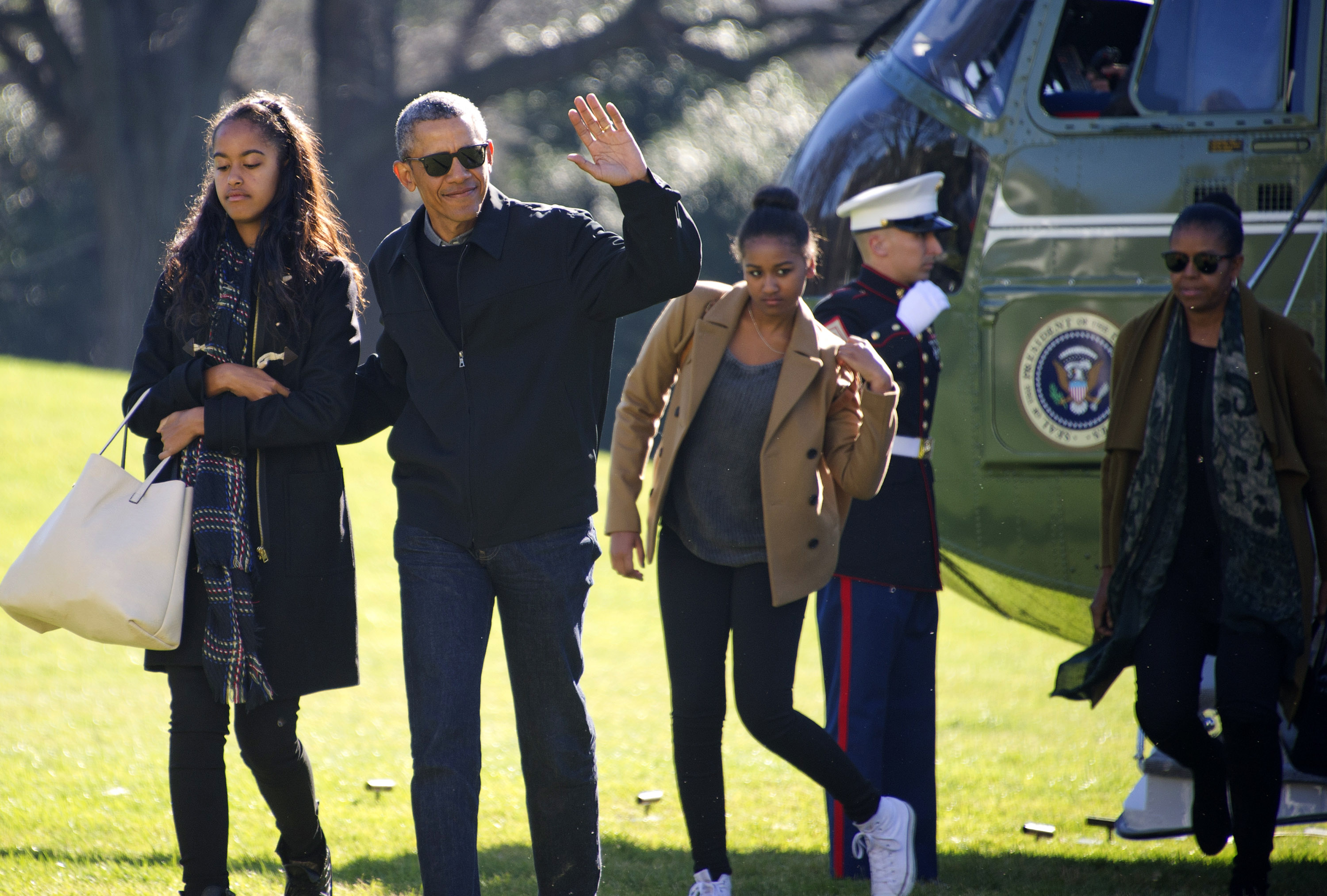 US President Barack Obama and his family (L-R) Malia, Sasha, and first lady Michelle Obama return to the South Lawn of the White HouseJanuary 3, 2016 in Washington, DC. The first family is returning from their two-week Hawaiian vacation. (Getty Images)