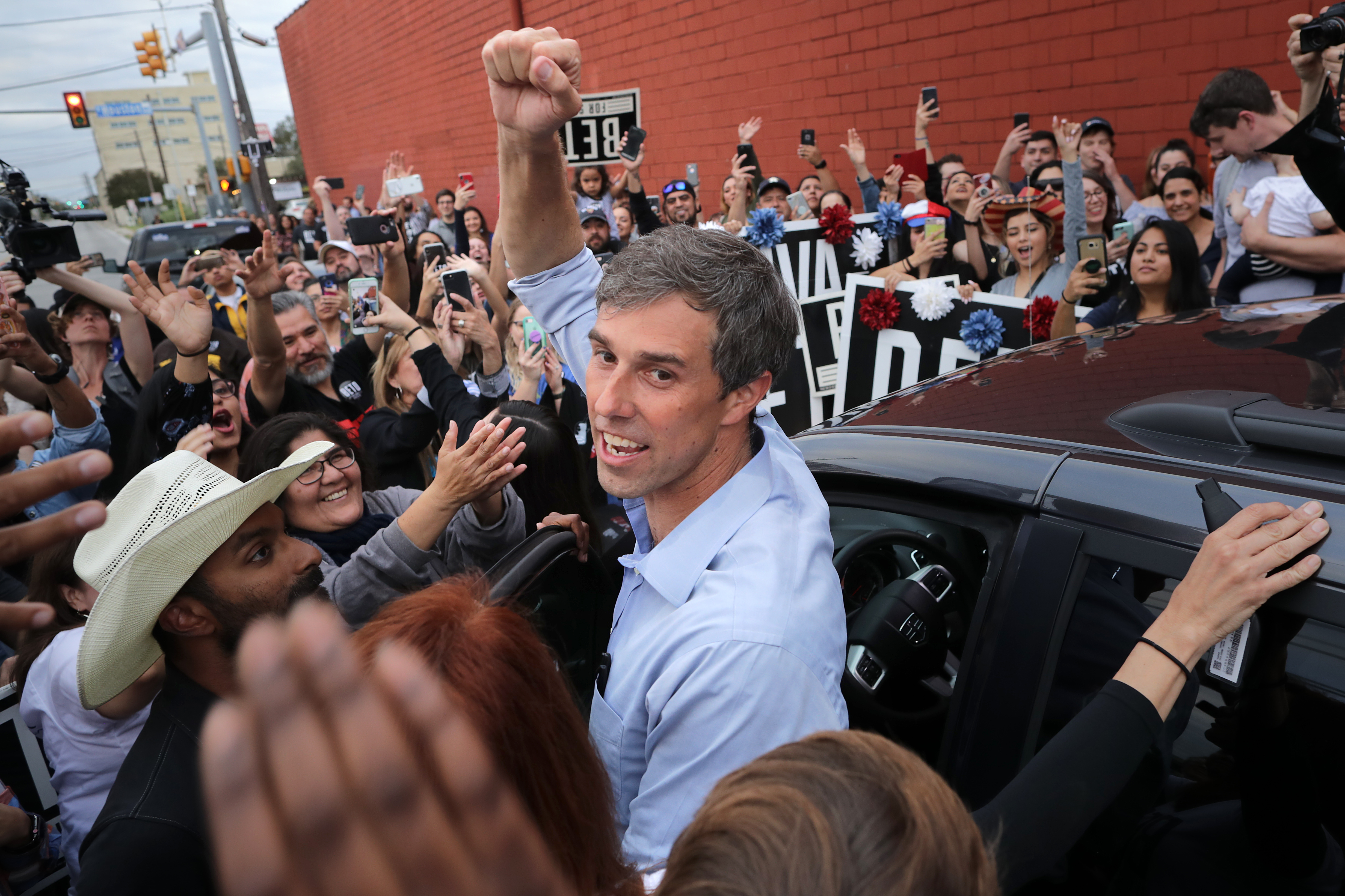 U.S. Senate candidate Rep. Beto O'Rourke (D-TX) pumps his fist for a cheering crowd before departing a campaign rally at the Alamo City Music Hall November 04, 2018, in San Antonio, Texas. As Election Day approaches polls have shown the gap narrow between O'Rourke his opponent, incumbent Sen. Ted Cruz (R-TX). (Source: Getty Images)