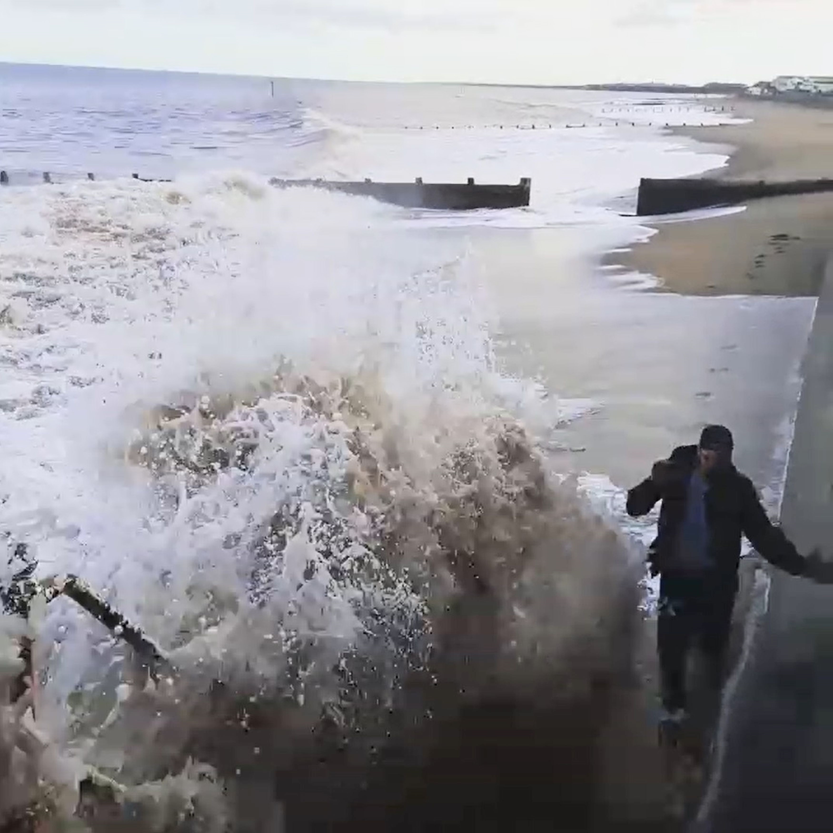 Cory stands and watches a wave coming in and tries to race it back to the shore (Kennedy News and Media)