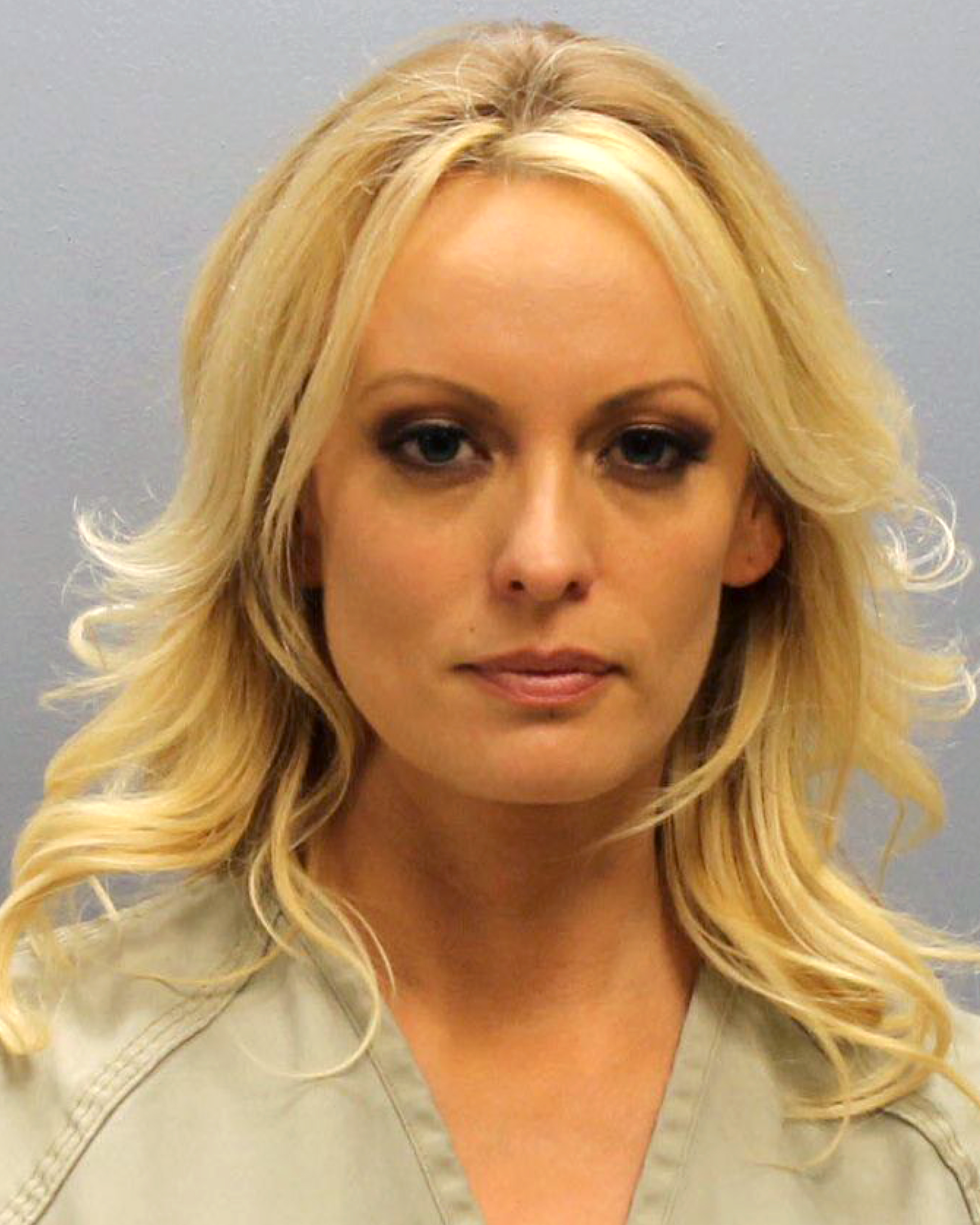 In this handout provided by Franklin County Sheriff's Office, adult film actress Stephanie Clifford aka Stormy Daniels poses for a mugshot photo after being arrested at an Ohio strip club for allegedly touching three undercover detectives during her performance in violation of state law July 12, 2018, in Columbus, Ohio. Daniels posted a $6,054 bail and was released (Source: Getty Images)