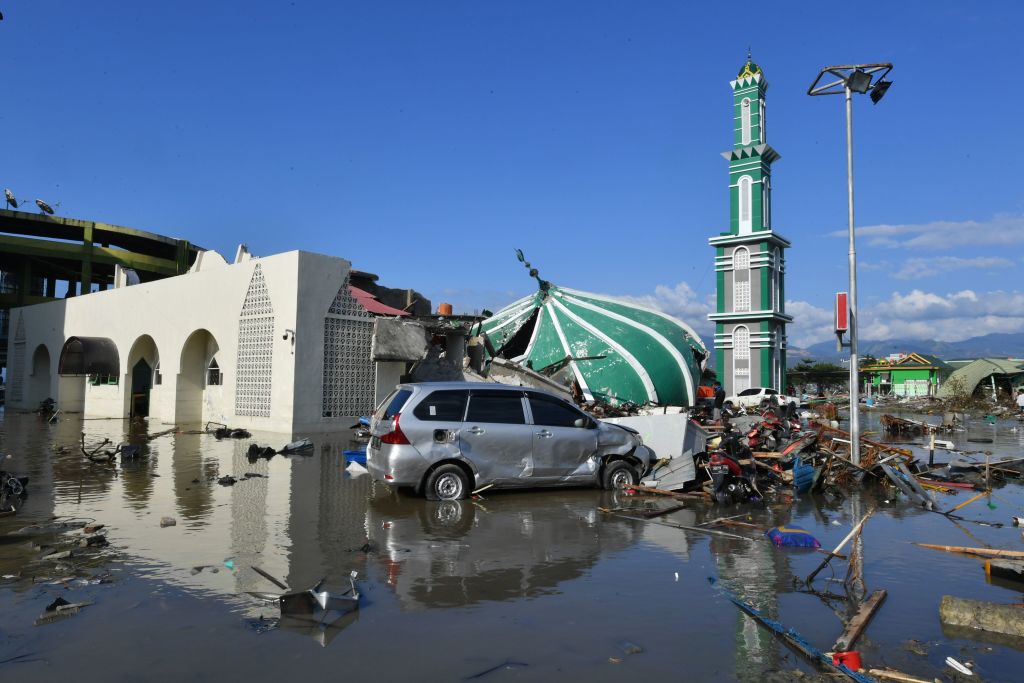 A collapsed mosque is seen amid waters from a tsunami surge in Palu, Indonesia's Central Sulawesi on September 30, 2018, following the September 28 earthquake and tsunami. The death toll in Indonesia rose to 832 on September 30. (Getty Images)