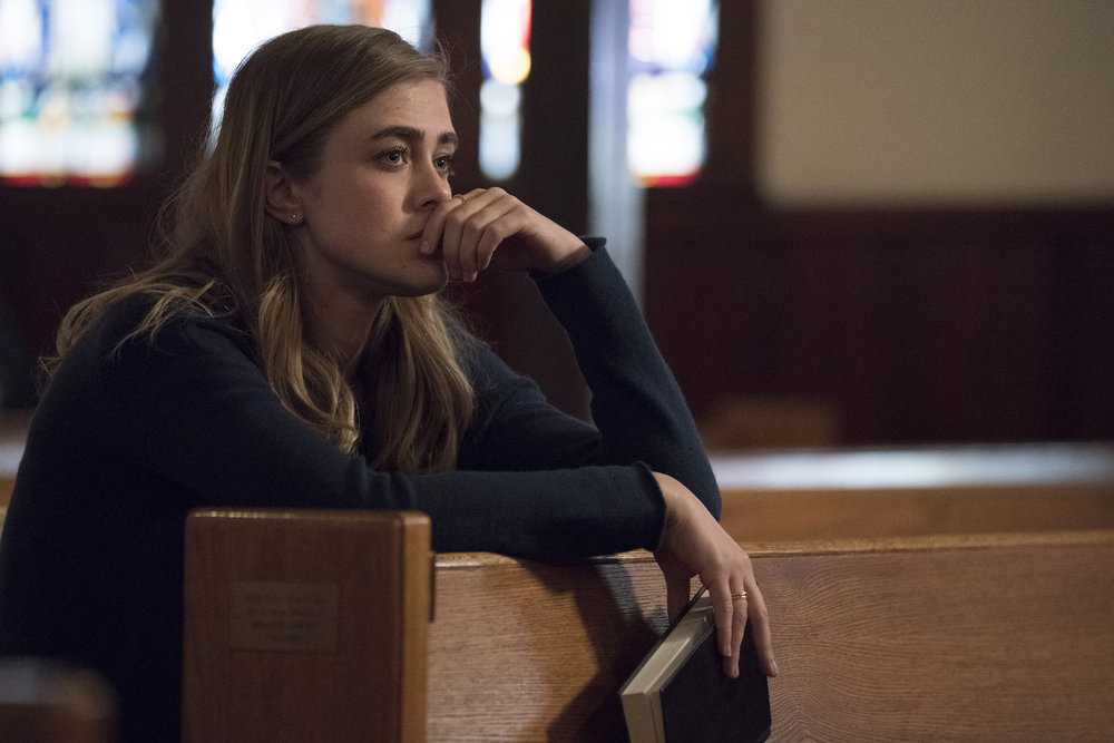 Michaela recalls her mother reading the Bible. (IMDb)