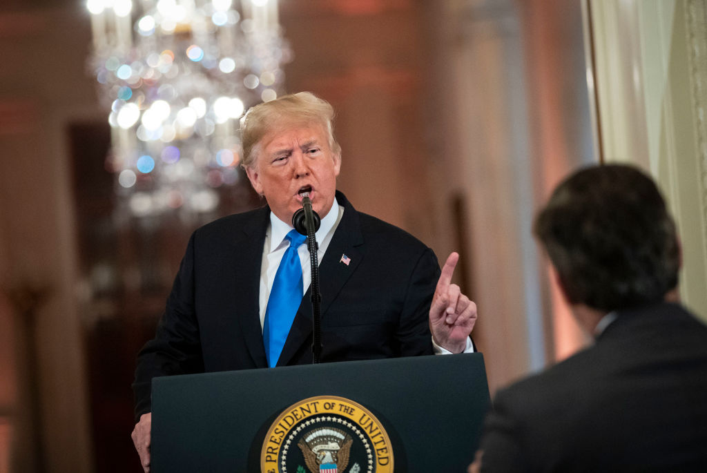 U.S. President Donald Trump gets into an exchange with CNN reporter Jim Acosta during a news conference a day after the midterm elections on November 7, 2018, in the East Room of the White House in Washington, DC. (Photo by Al Drago - Pool/Getty Images)