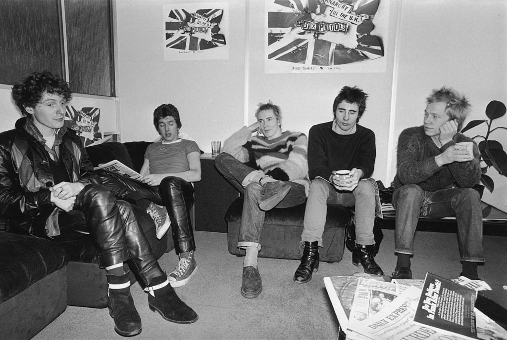 Notorious British punk rock band The Sex Pistols at the EMI studios, 2nd December 1976. From left to right, manager Malcolm McLaren, Steve Jones, Johnny Rotten (John Lydon), Glen Matlock and Paul Cook. (Source: R. Jones/Evening Standard/Hulton Archive/Getty Images)