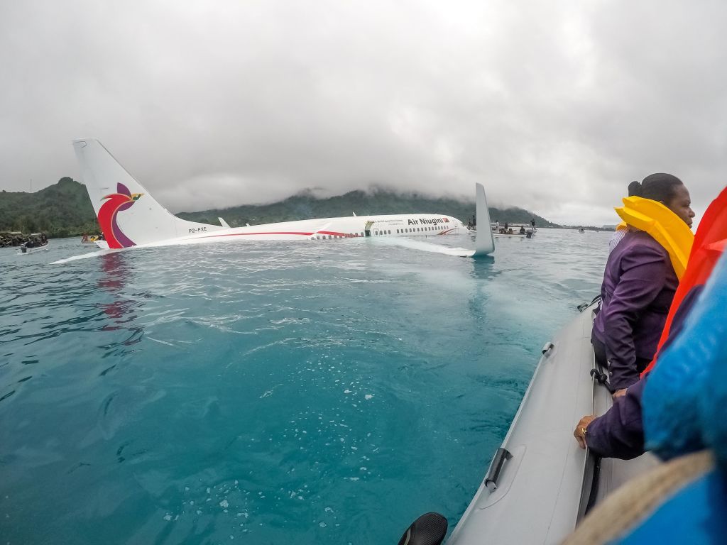 U.S. Navy Sailors from Underwater Construction Team (UCT) 2 assist local authorities in shuttling the passengers and crew of Air Niugini flight PX56 to shore following the plane crashing into the sea on its approach to Chuuk International Airport on September 28, 2018, in the Federated States of Micronesia. (Getty Images)