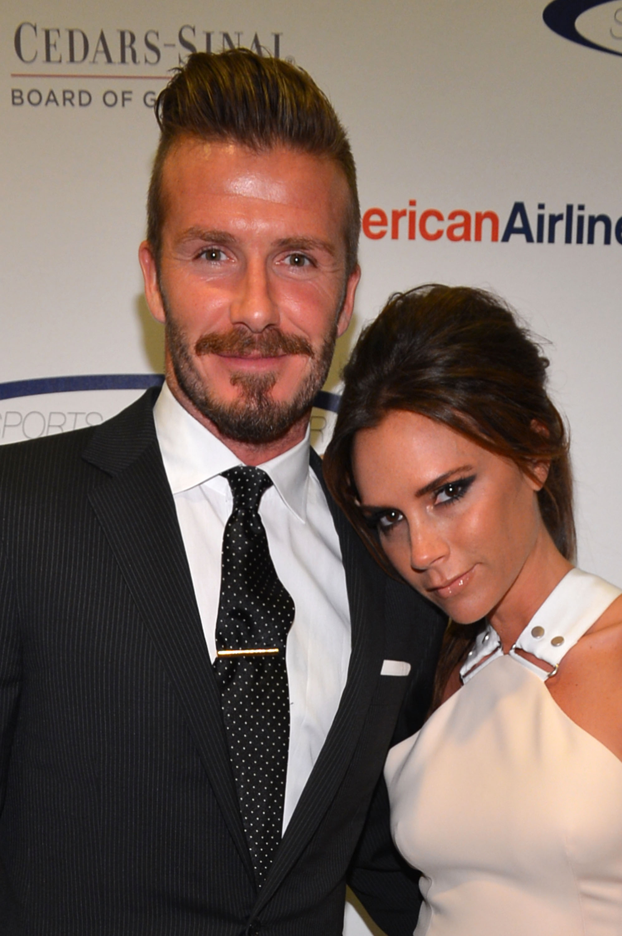 Professional soccer player David Beckham and wife Victoria Beckham arrive at the 27th Anniversary Sports Spectacular benefiting Cedars-Sinai Medical Genetics Institute at the Hyatt Regency Century Plaza on May 20, 2012 in Century City, California.