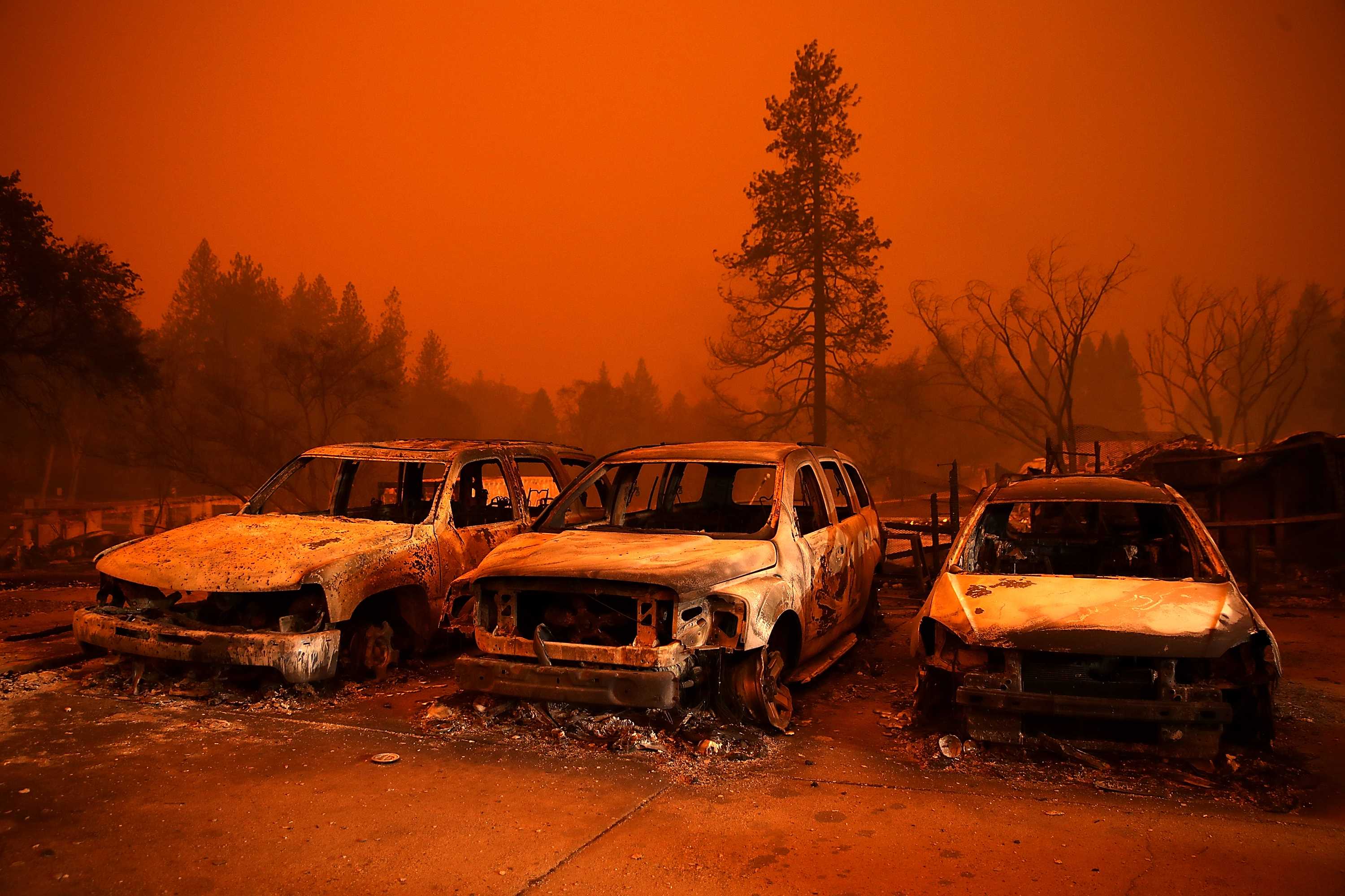 Cars destroyed by the Camp Fire sit in the lot at a used car dealership on November 9, 2018, in Paradise, California. Fueled by high winds and low humidity, the rapidly spreading Camp Fire ripped through the town of Paradise and has quickly charred 70,000 acres and has destroyed numerous homes and businesses in a matter of hours. (Getty Images)