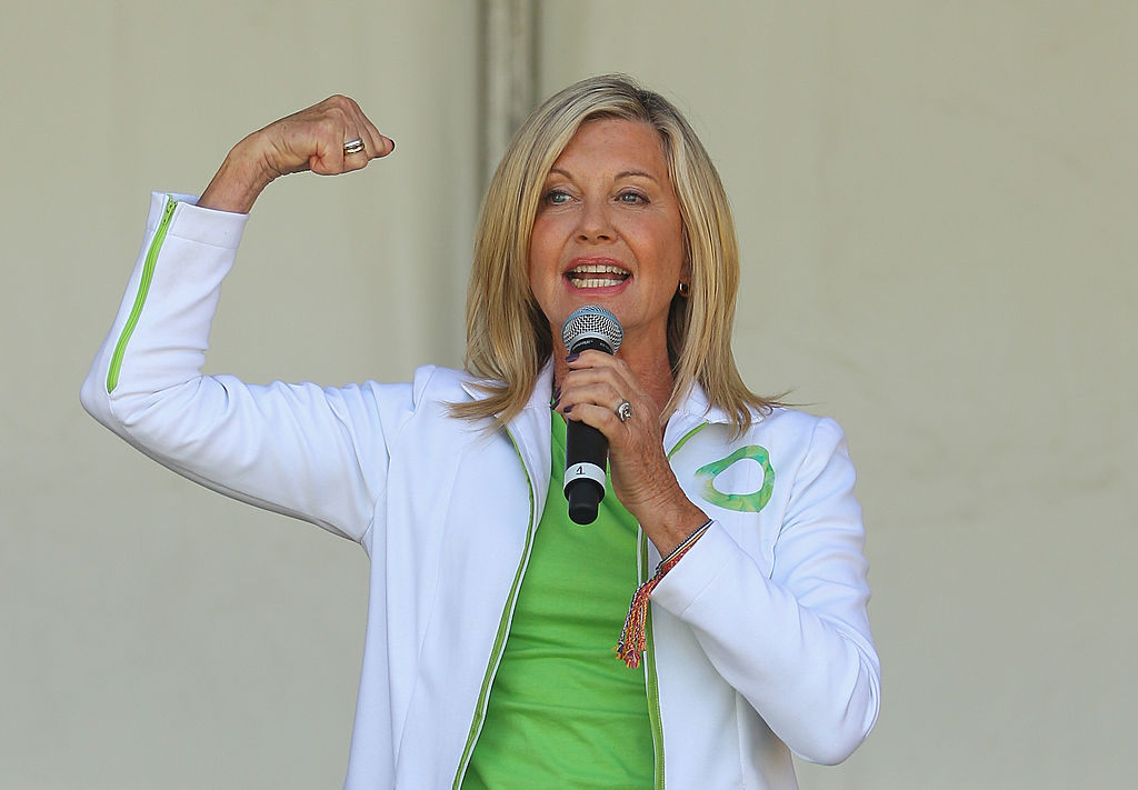 Australian actress, Olivia Newton-John performs her song 'Physical' on stage before leading the inaugural Wellness Walk on September 15, 2013 in Melbourne, Australia. (Photo by Scott Barbour/Getty Images)