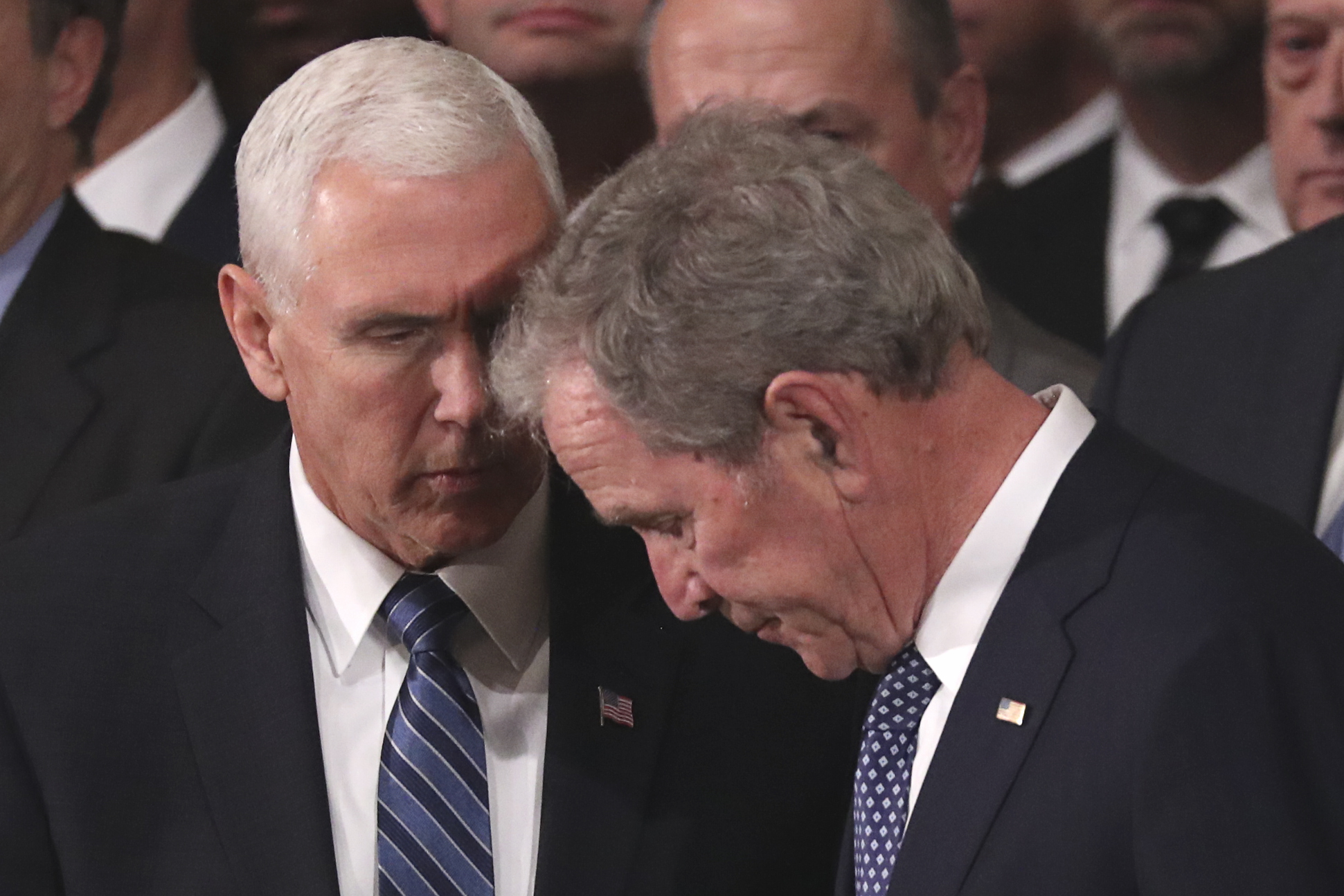 U.S. Vice President Mike Pence speaks with former President George W. Bush during an arrival ceremony as former President George H.W. Bush lies in state in the U.S. Capitol Rotunda on December 3, 2018, in Washington, DC. (Getty)