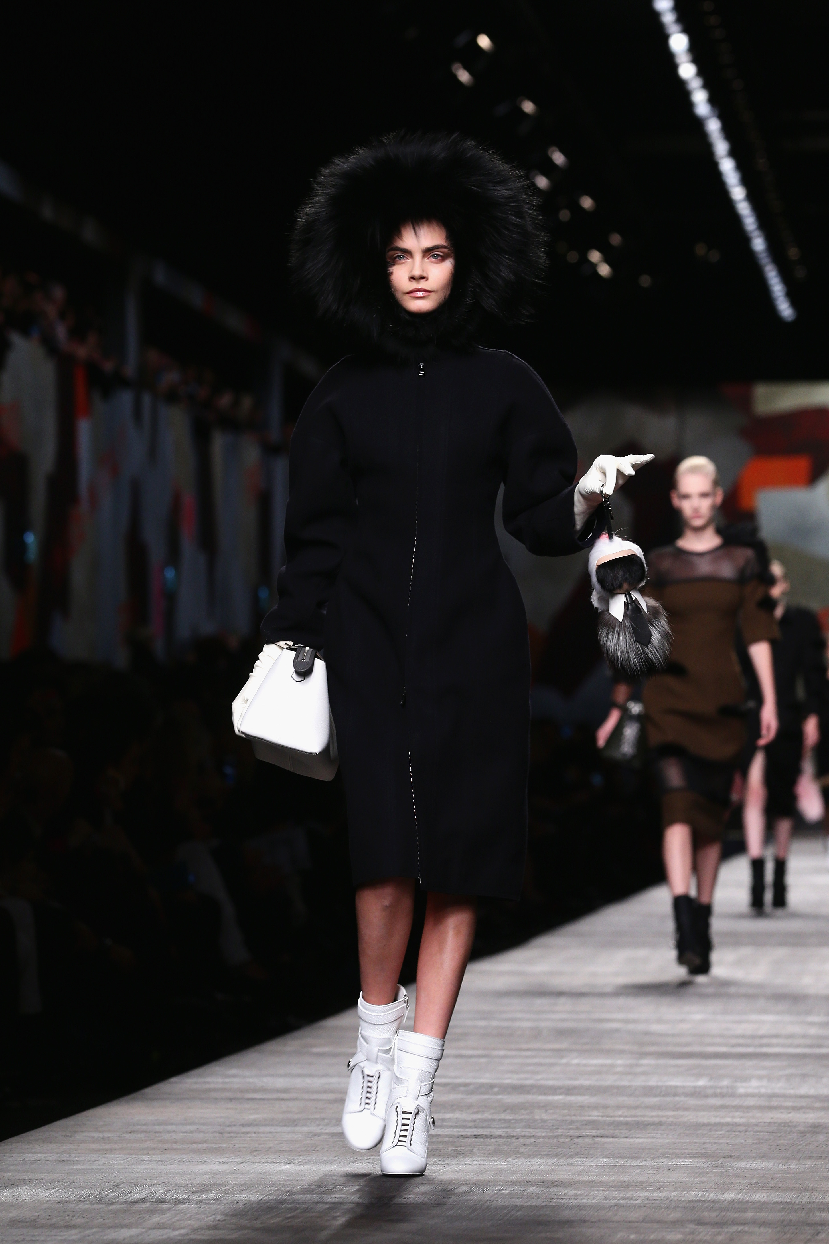 Model Cara Delevingne walks the runway during the Fendi show as part of Milan Fashion Week Womenswear Autumn/Winter 2014 on February 20, 2014 in Milan, Italy.