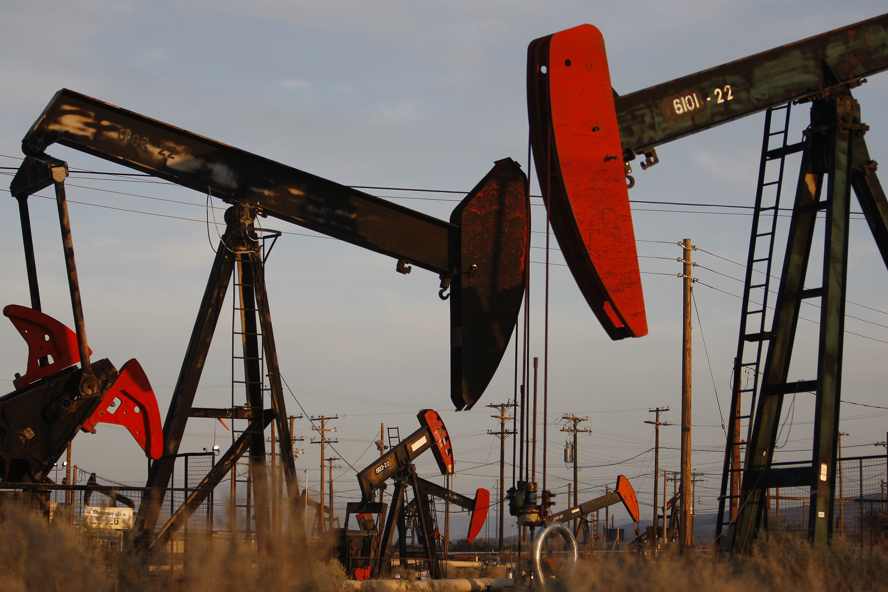 Pump jacks and wells are seen in an oil field on the Monterey Shale formation where gas and oil extraction using hydraulic fracturing, or fracking, is on the verge of a boom on March 23, 2014 near McKittrick, California.