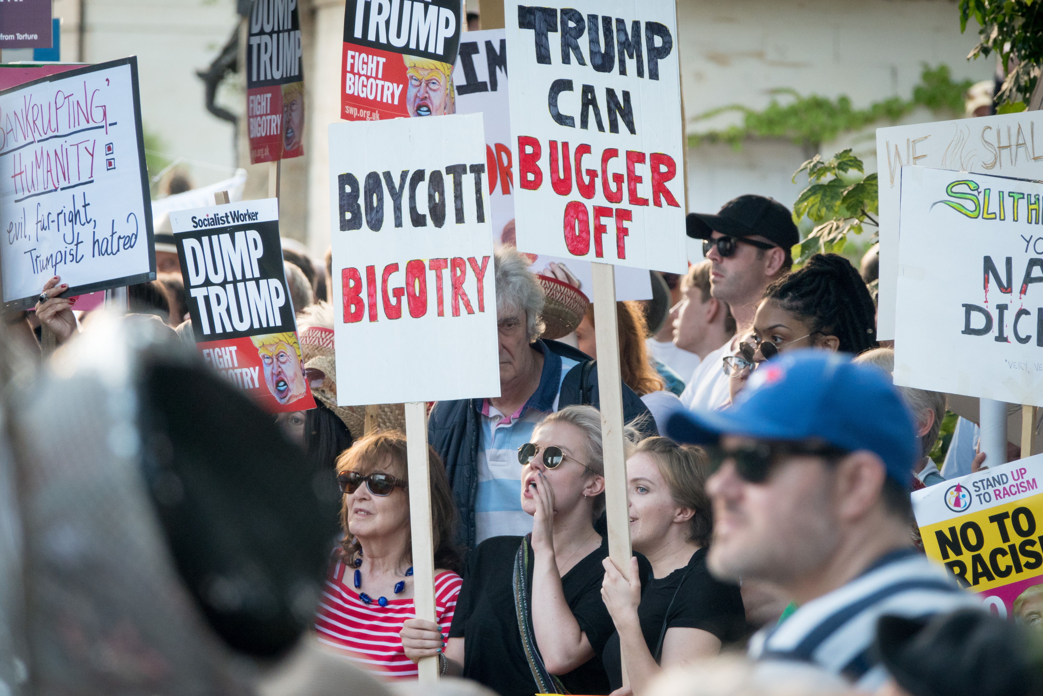 Protesters gather at the gates of Blenheim Palace where U.S. President Donald Trump is attending an evening function in Woodstock on July 12, 2018 in Oxfordshire, England.