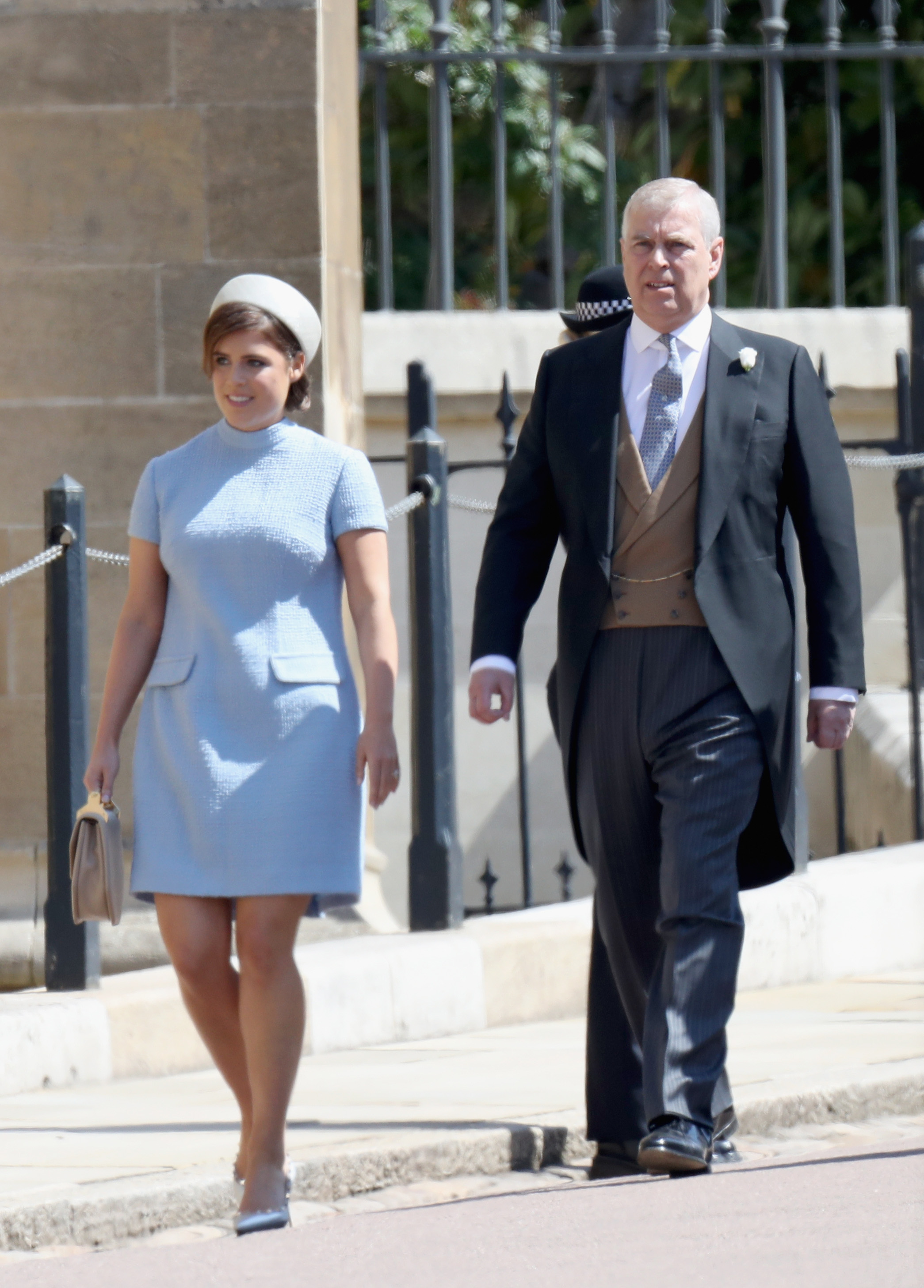 (L-R) Princess Eugenie and Prince Andrew, Duke of York attend the wedding of Prince Harry to Ms Meghan Markle at St George's Chapel, Windsor Castle on May 19, 2018 in Windsor, England. Prince Henry Charles Albert David of Wales marries Ms. Meghan Markle in a service at St George's Chapel inside the grounds of Windsor Castle. Among the guests were 2200 members of the public, the royal family and Ms. Markle's Mother Doria Ragland.