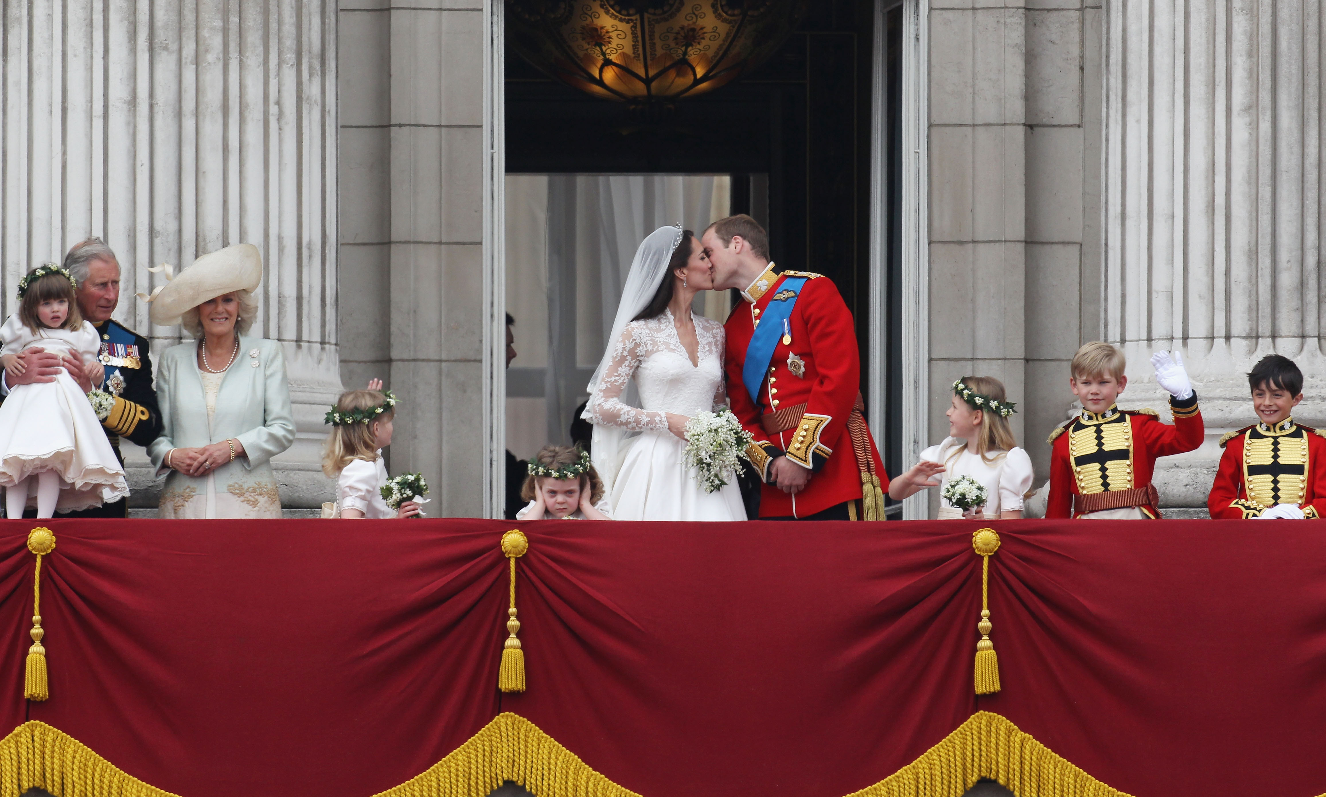 Their Royal Highnesses Prince William, Duke of Cambridge and Catherine, Duchess of Cambridge kiss on the balcony at Buckingham Palace on April 29, 2011 in London, England. The marriage of the second in line to the British throne was led by the Archbishop of Canterbury and was attended by 1900 guests, including foreign Royal family members and heads of state. Thousands of well-wishers from around the world have also flocked to London to witness the spectacle and pageantry of the Royal Wedding.