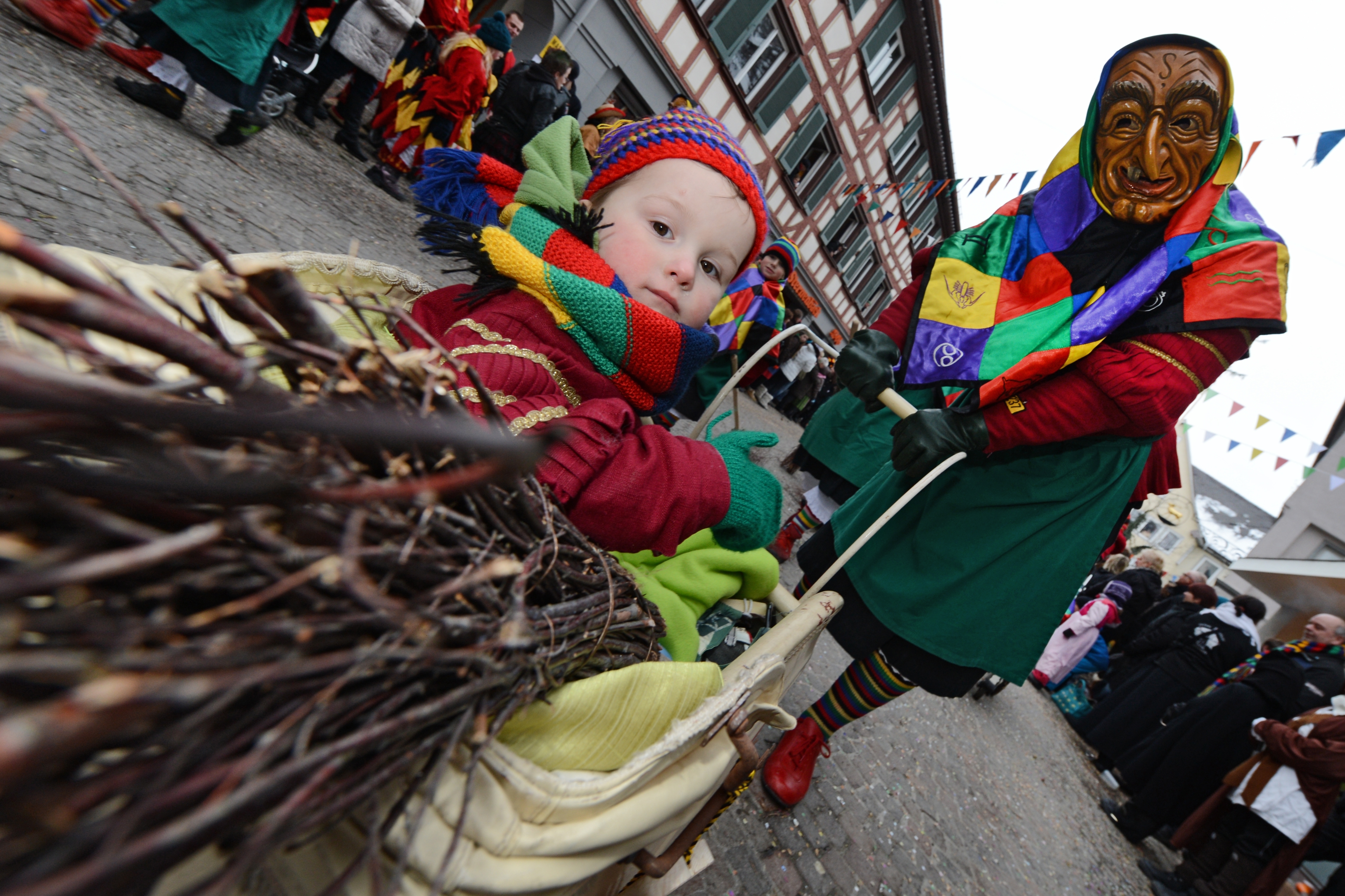 A person dressed up in a witch costume pushes their baby during the witch festival in Bad Salgau, southern Germany (Source: Getty Images)