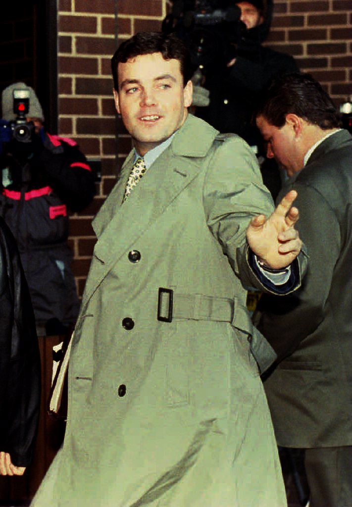 John Wayne Bobbitt points toward photographers as he arrives at the Prince William County Courthouse in Manassas, VA 18 January 1994 for the fifth day of his wife Lorena's trial for malicious wounding (Source: JENNIFER YOUNG/AFP/Getty Images)