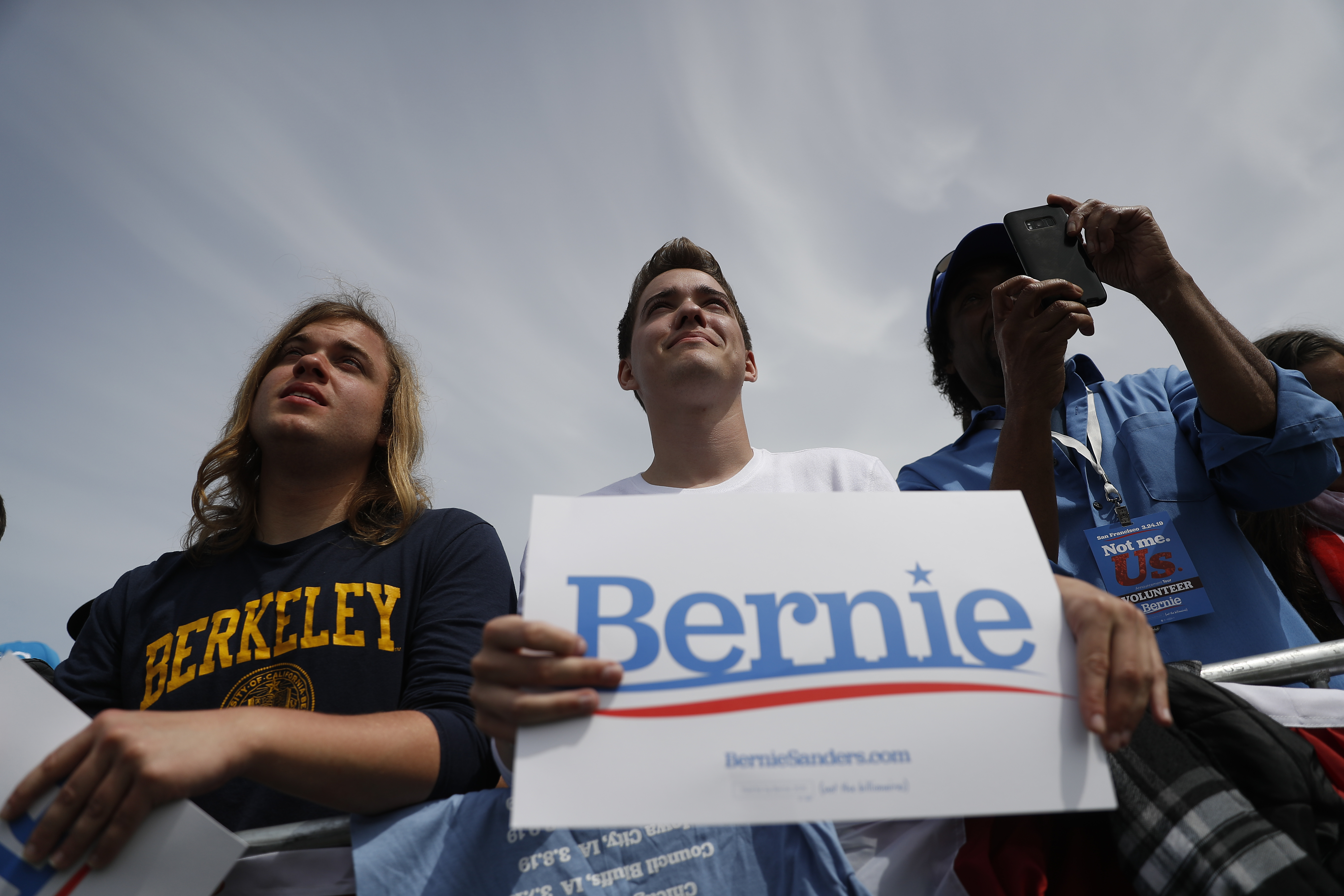 Supporters of 2020 Democratic presidential candidate U.S. Sen. Bernie Sanders (I-VT) listen during a campaign rally at Great Meadow Park in Fort Mason on March 24, 2019, in San Francisco, California. (Getty)