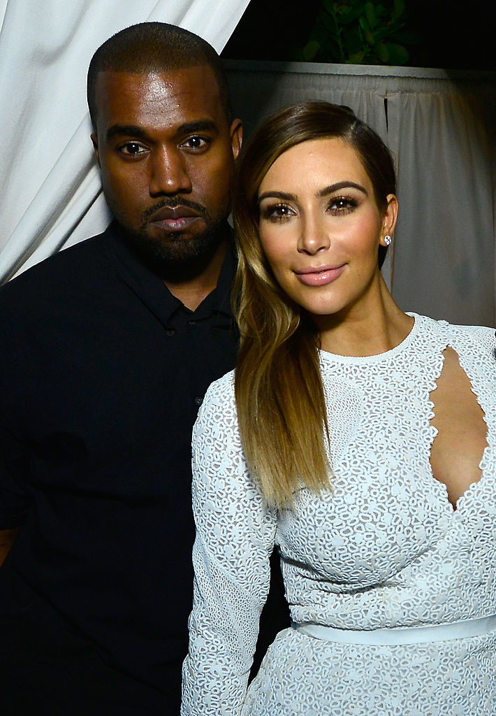 The 25-year-old rap artist wore a white tuxedo with a black bow tie, while his beaming bride walked down the aisle in a white strapless dress to a star-studded guest list consisting of Kanye and Kim Kardashian West. (Photo by Eugene Gologursky/Getty Images for DuJour Magazine)