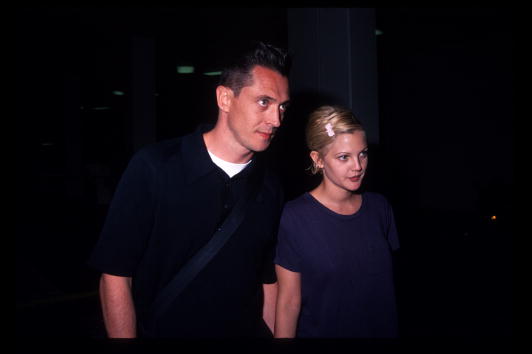 Actress Drew Barrymore and her husband Jeremy Thomas attend the premiere of 'Bad Girls' April 19, 1994, in Los Angeles, CA. (Photo by Barry King/Liaison)