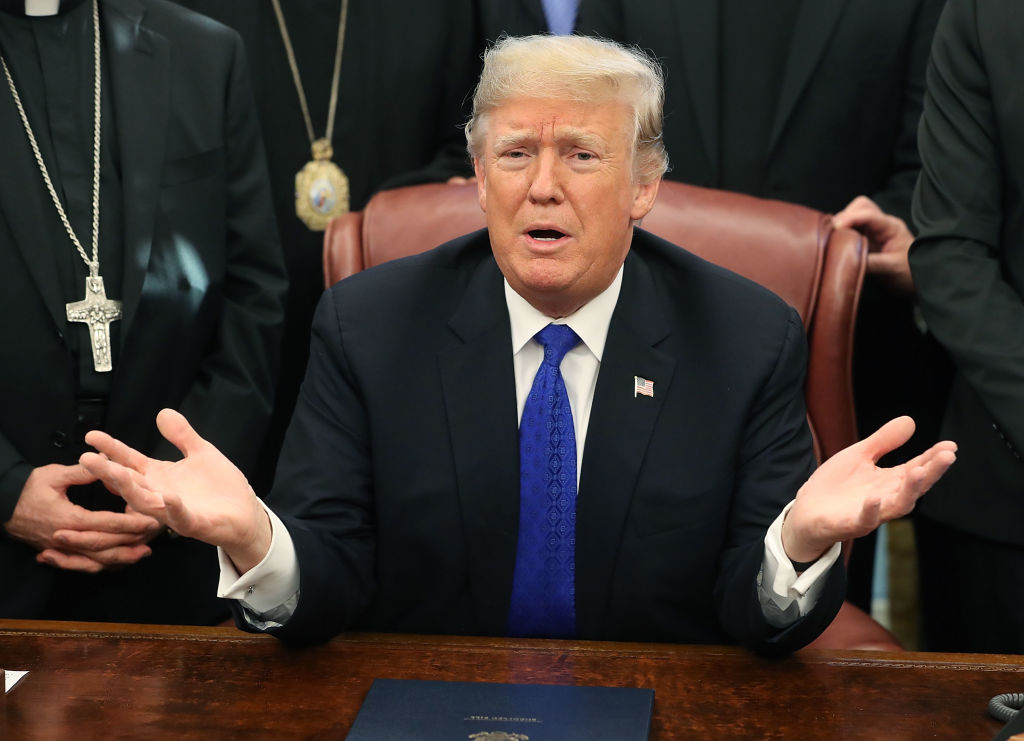 U.S. President Donald Trump speaks after signing H.R. 390, the 'Iraq and Syria Genocide Relief and Accountability Act of 2018' in the Oval Office at the White House on December 11, 2018 (Source: Mark Wilson/Getty Images)